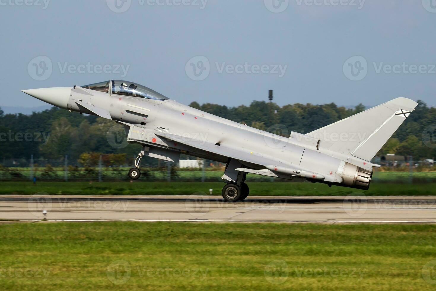 Military fighter jet plane at air base. Airport and airfield. Air force flight operation. Aviation and aircraft. Air defense. Military industry. Fly and flying. photo