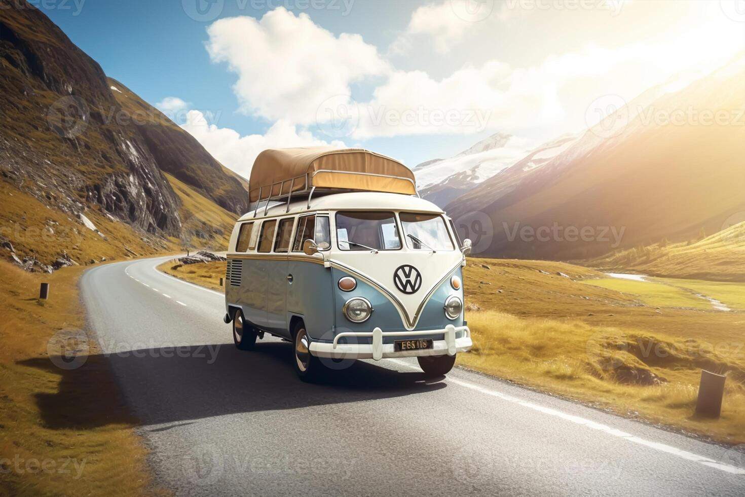 Vintage camper van on road in the mountains photo