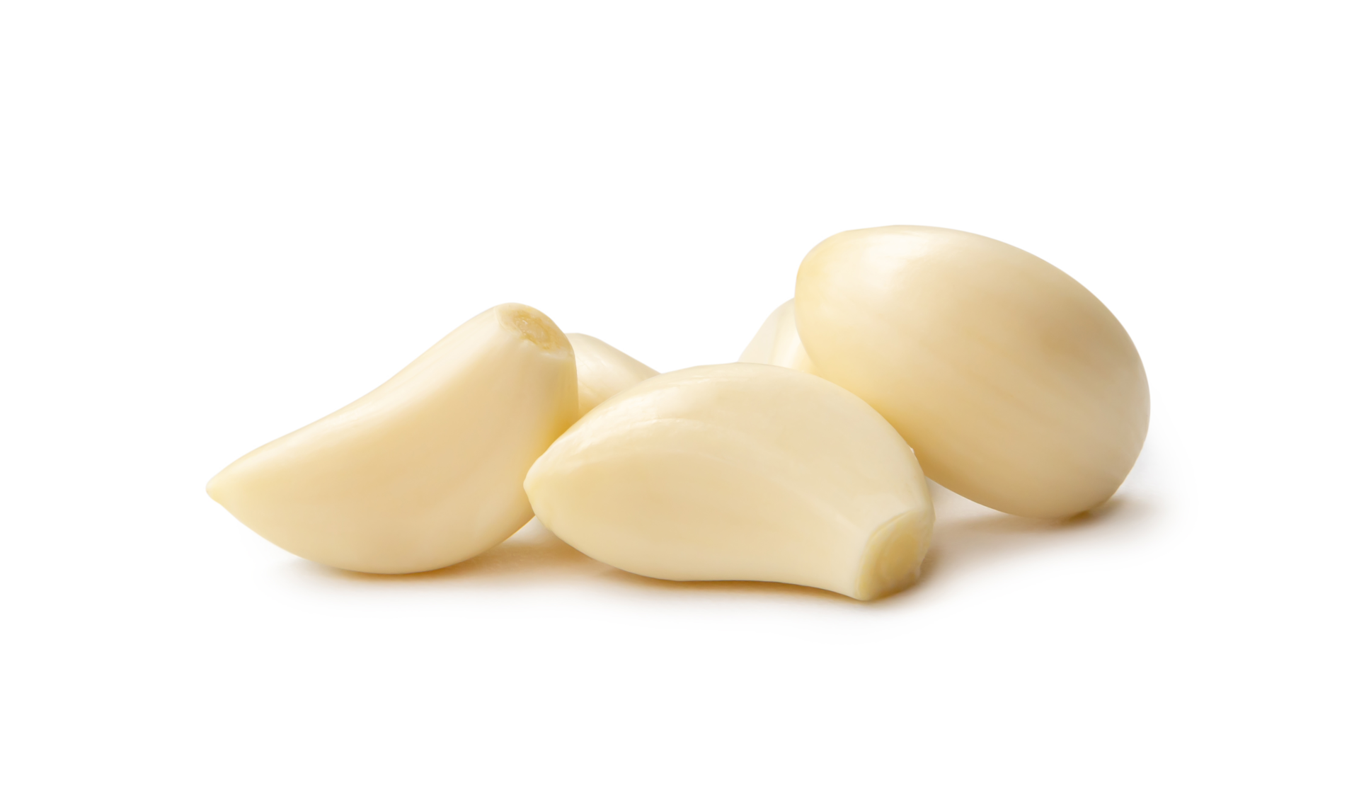 Peeled garlic cloves in stack isolated with clipping path and shadow in