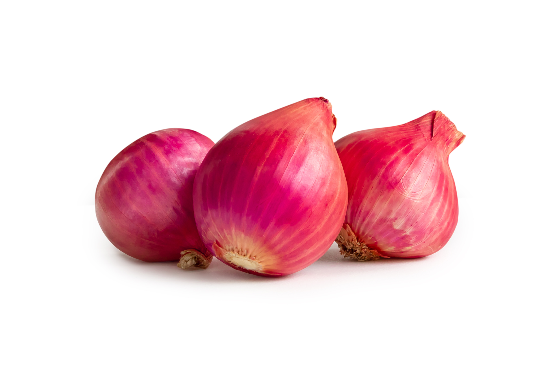 Fresh red onions in stack isolated with clipping path and shadow in png