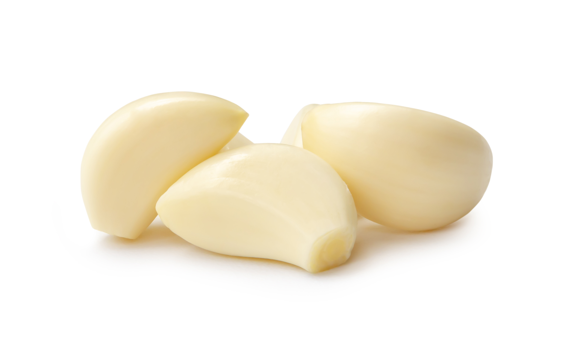 Peeled garlic cloves in stack isolated with clipping path and shadow in