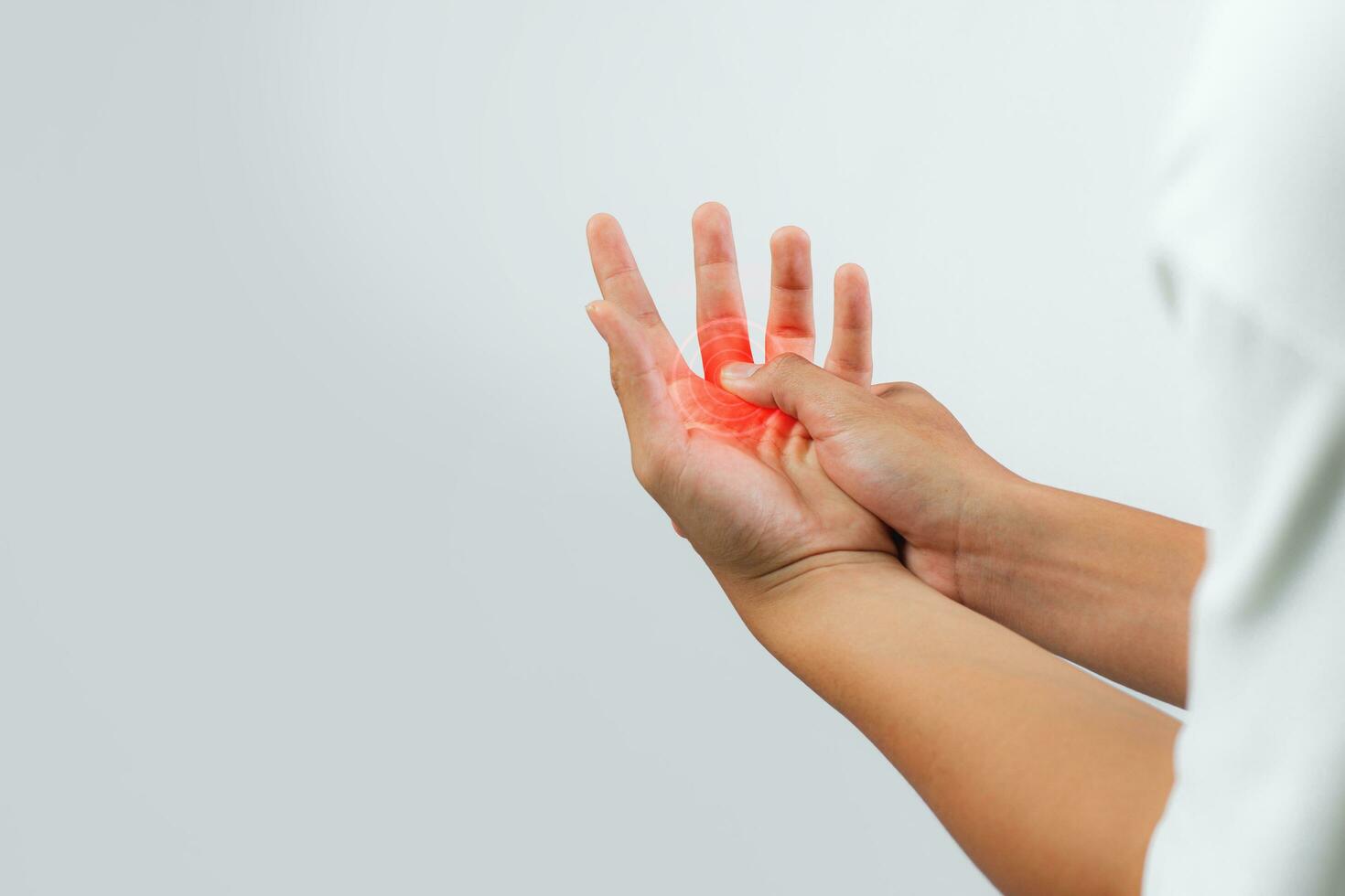 A male patient suffering from joint, finger pain and numbness, depicting a medical symptom, against a white background. photo