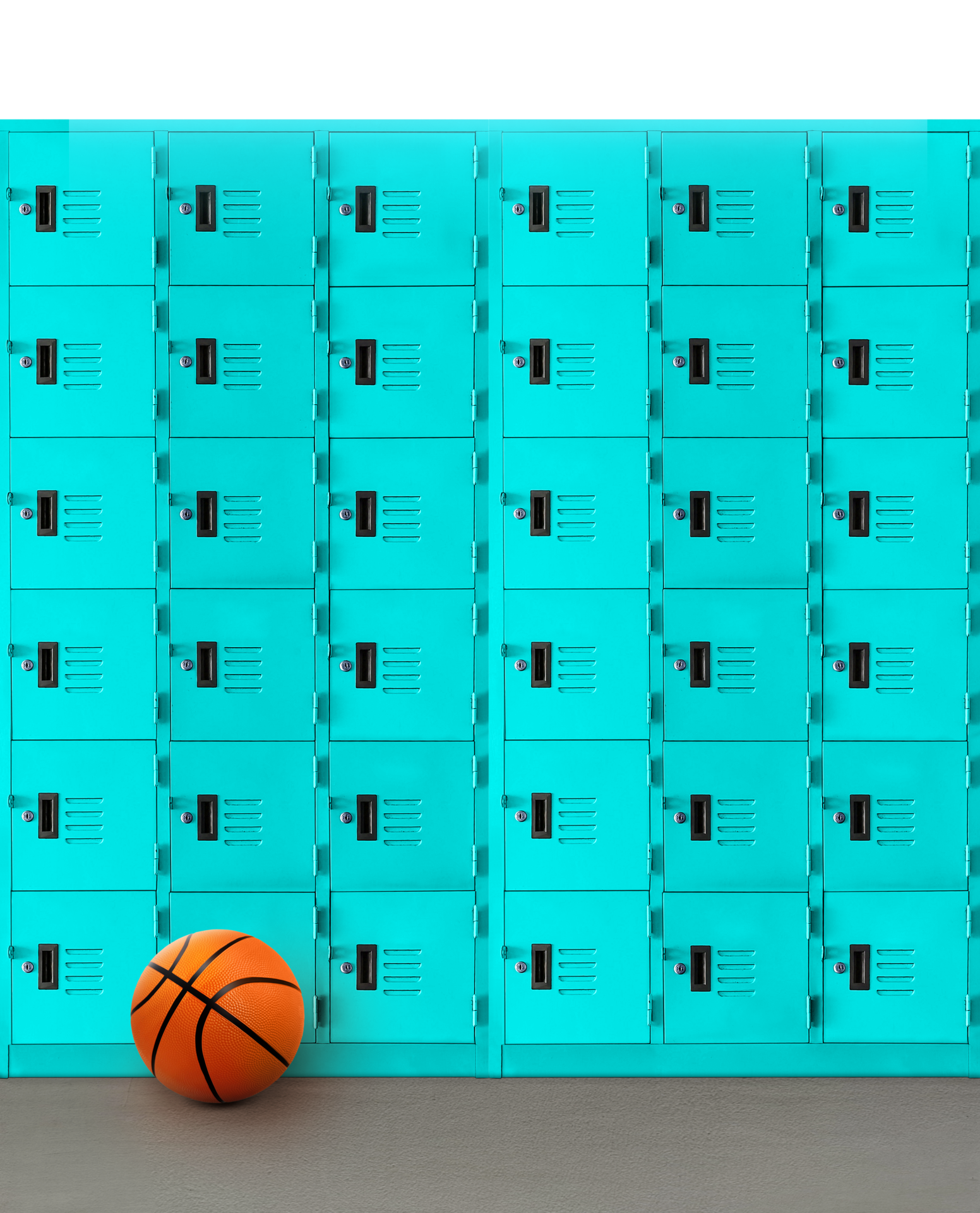 Basketball on cement floor with locker in the background PNG