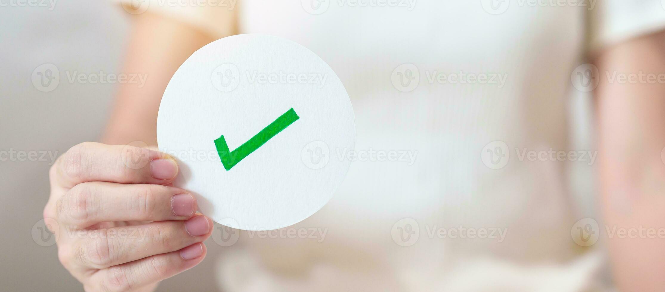 Woman show Right symbol paper. True and false, accept and rejected, evaluation, Vote, Poll, Yes or No and Survey concepts photo