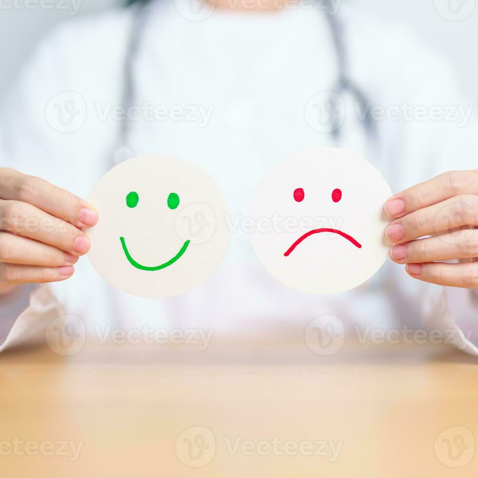 Doctor show Happy smile and Unhappy Sad face paper, Mental health Assessment, Psychology, Health Wellness, Feedback, Customer Review, Experience, Satisfaction Survey, World Mental Health day concept photo