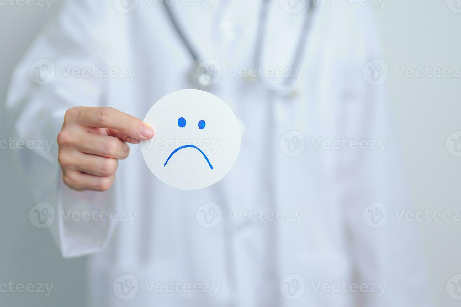 Doctor show Unhappy sad face paper, Mental health Assessment, Psychology, Health Wellness, Negative Feedback, Customer Review, Bad Experience, Satisfaction Survey, World Mental Health day concept photo