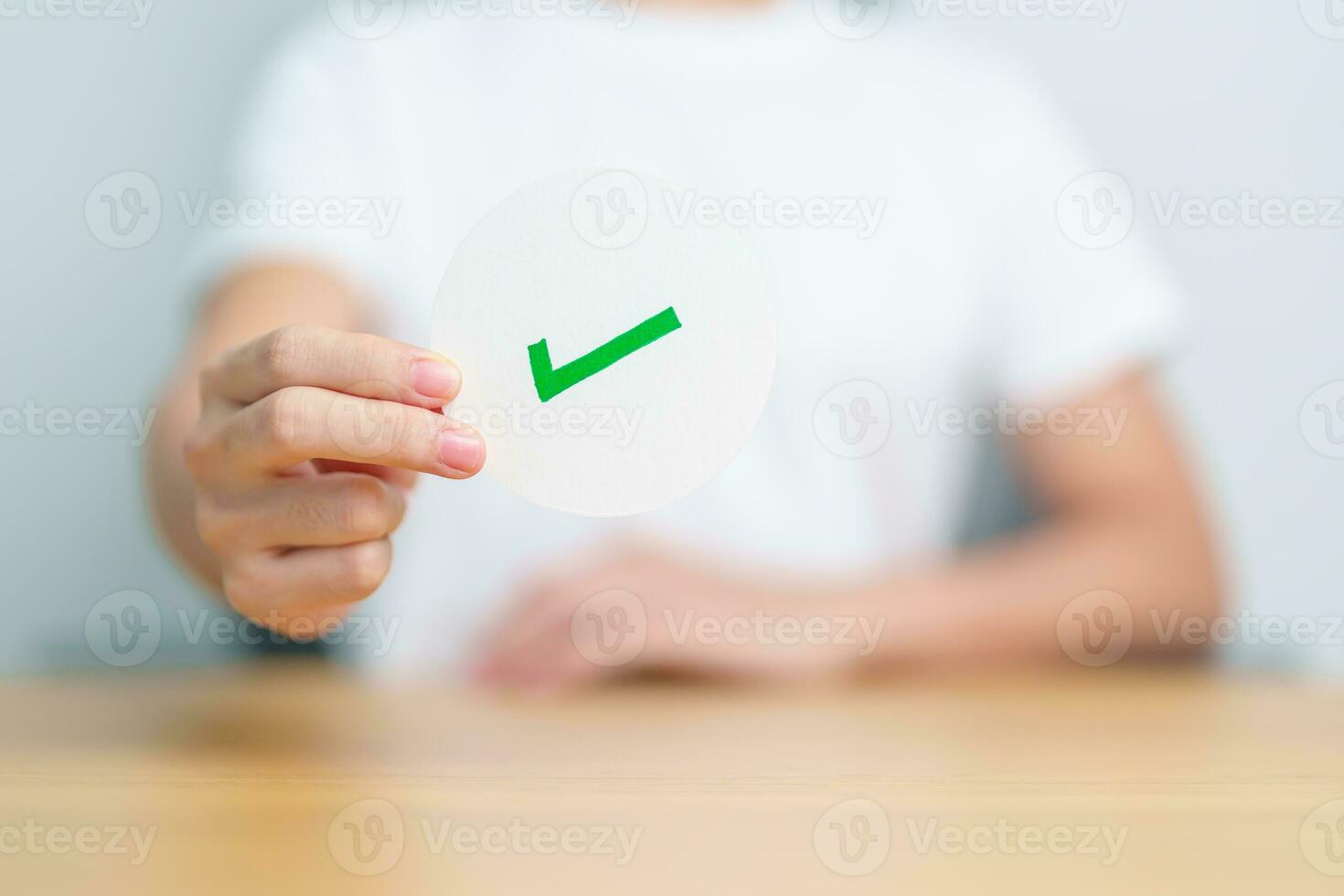 Woman show Right symbol paper. True and false, accept and rejected, evaluation, Vote, Poll, Yes or No and Survey concepts photo