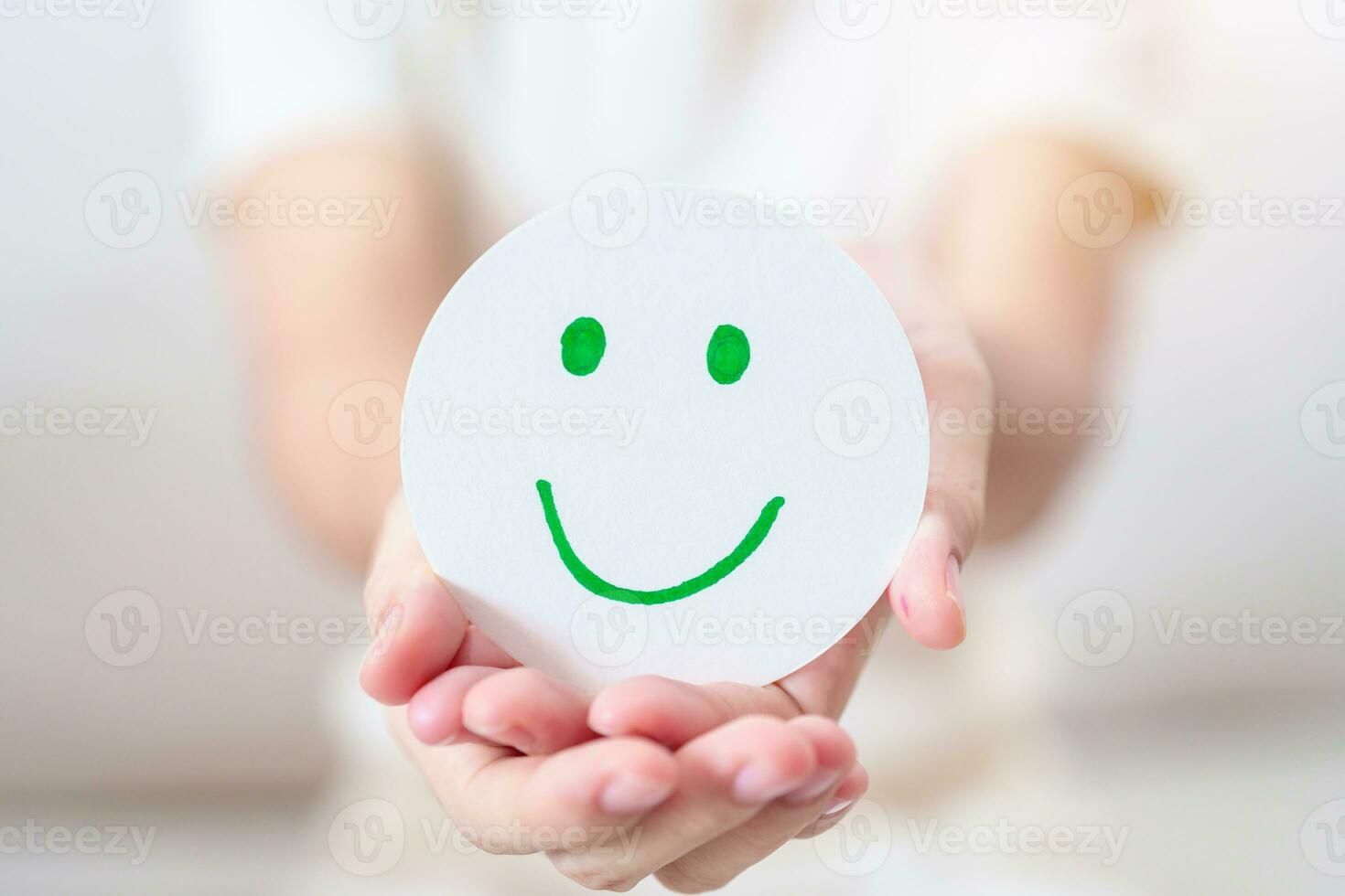 Woman show Happy Smile face paper, Mental health Assessment, Psychology, Health Wellness, Feedback, Customer Review, Experience, Satisfaction Survey, Positive Thinking and World Mental Health day photo