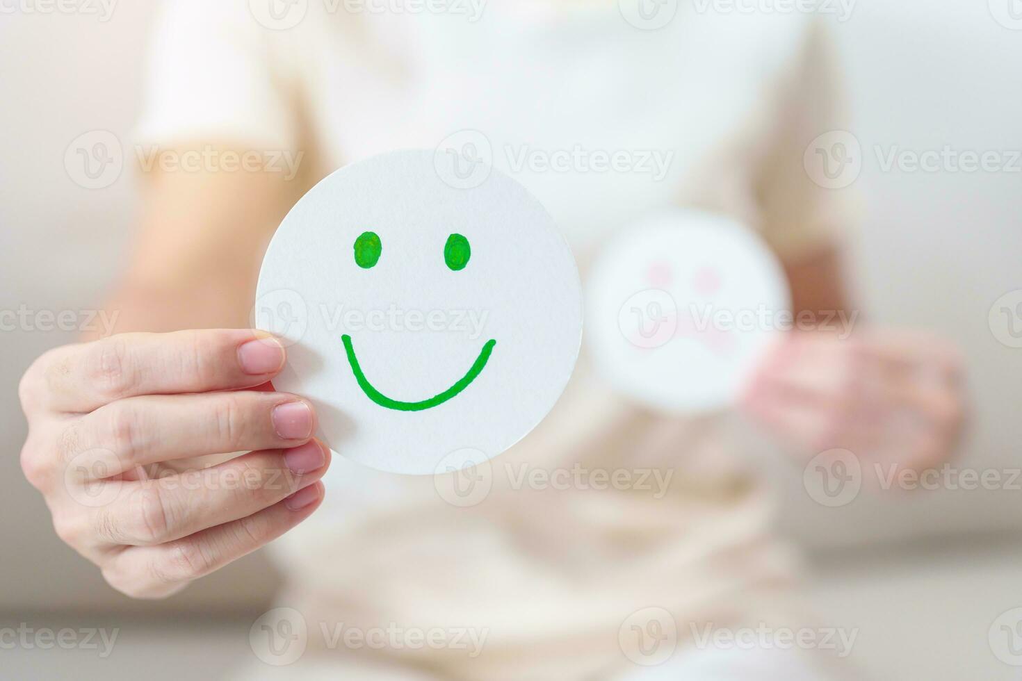 Woman show Happy Smile face paper, Mental health Assessment, Psychology, Health Wellness, Feedback, Customer Review, Experience, Satisfaction Survey, Positive Thinking and World Mental Health day photo