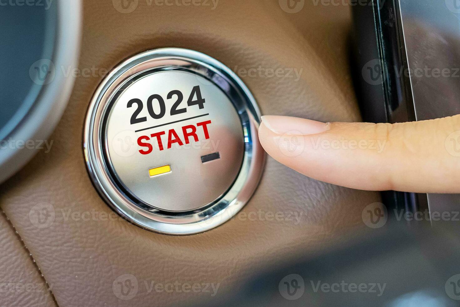 Finger press a car ignition button with 2024 START text inside  automobile. New Year New You, forecast, resolution, motivation, change, goal, vision, innovation and planning concept photo