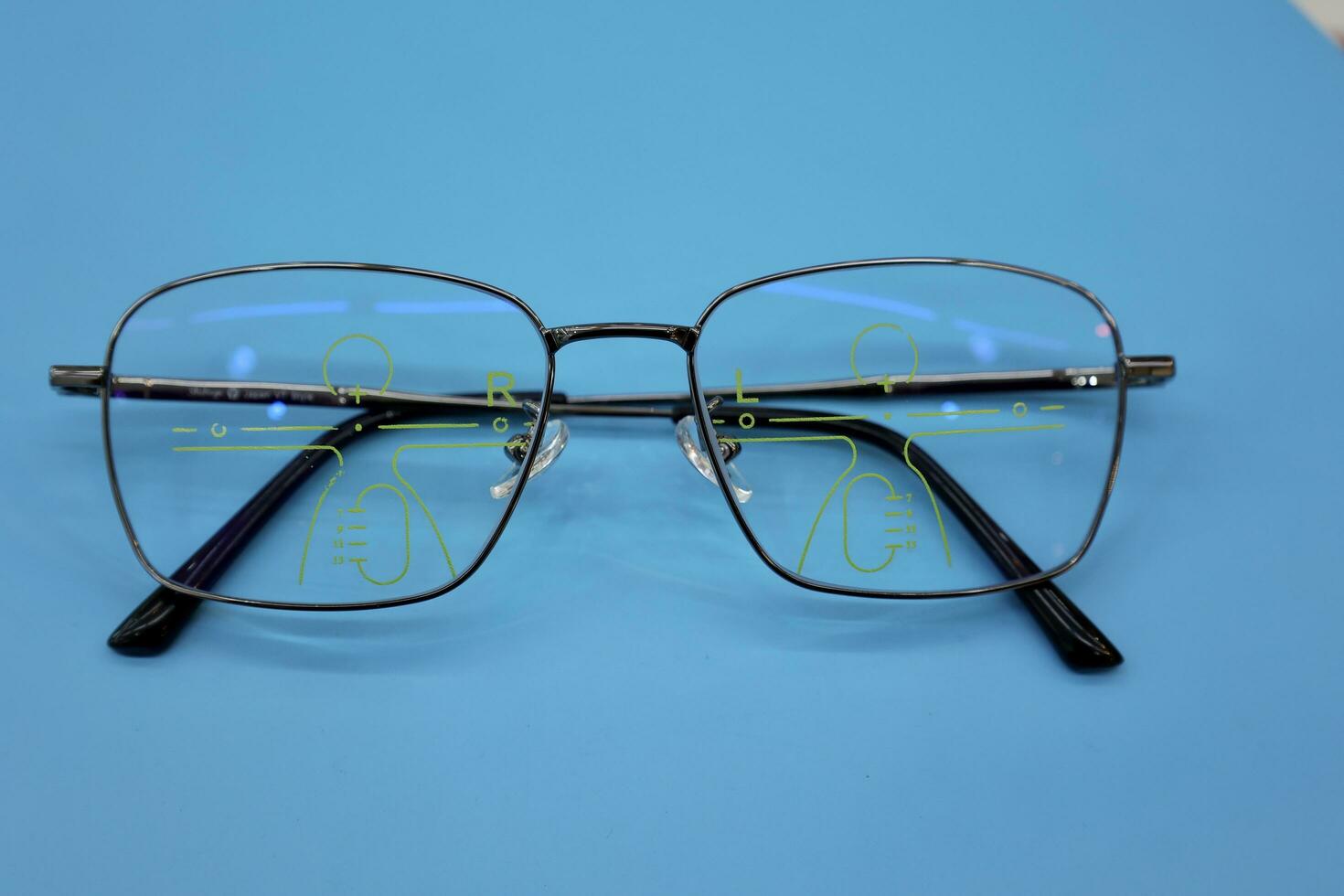 Glasses are placed on the table in the ophthalmologist. photo