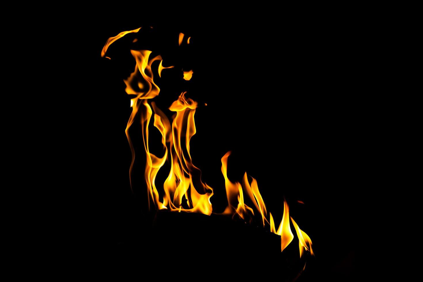 Fire flame texture. Burning material backdrop. Burn effect pattern. Blaze and torch wallpaper. Heat and haze backdrop. photo