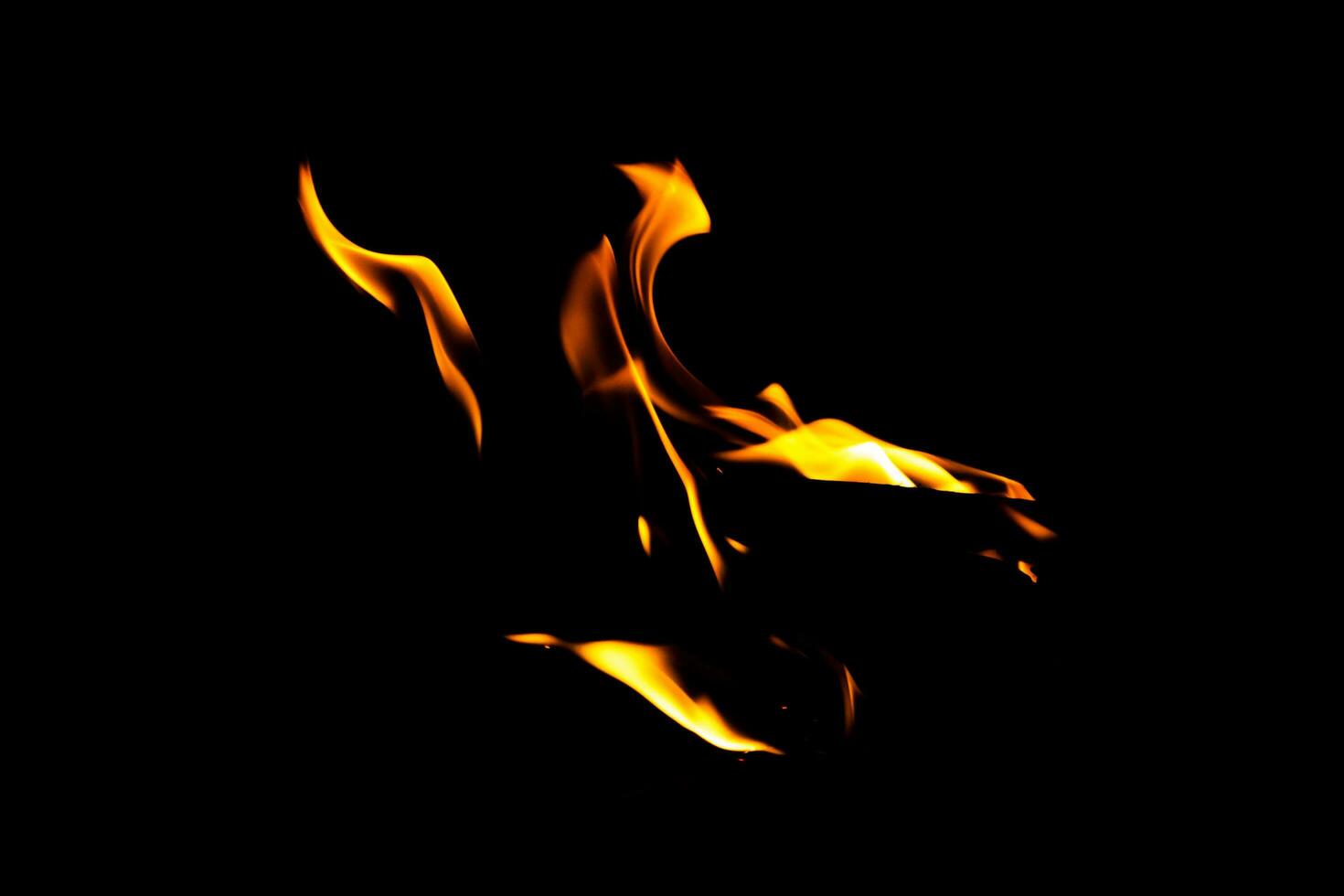 Fire flame texture. Burning material backdrop. Burn effect pattern. Blaze and torch wallpaper. Heat and haze backdrop. photo