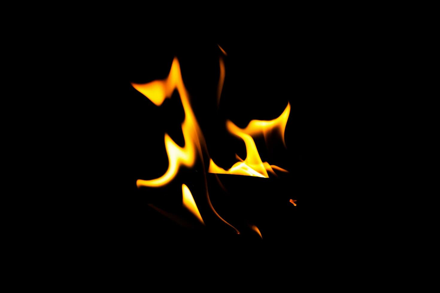 Fire flame texture. Burning material backdrop. Burn effect pattern. Blaze and torch wallpaper. Heat and haze backdrop. photo