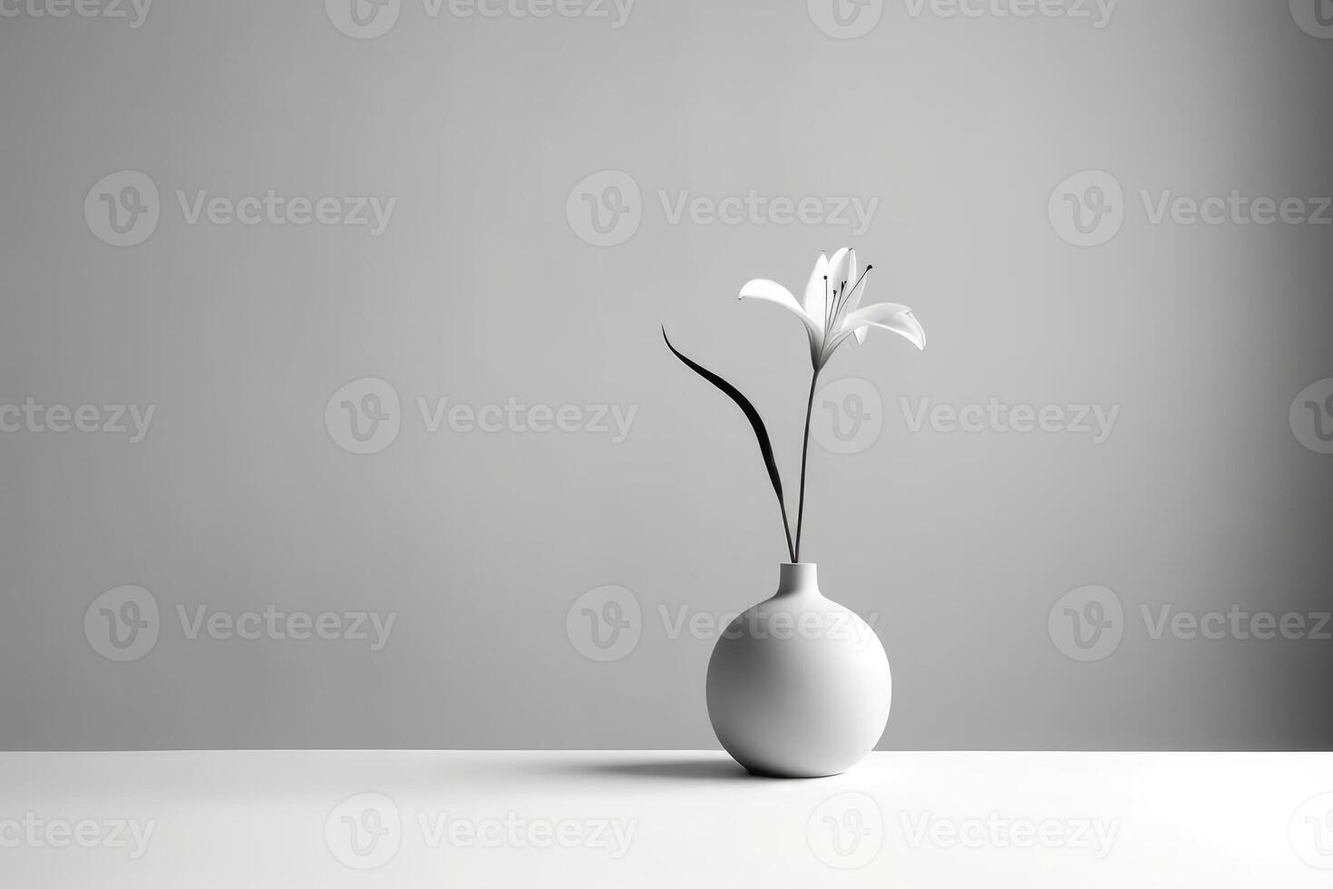 A monochromatic photograph of a single flower in a minimalist vase against a plain background. photo