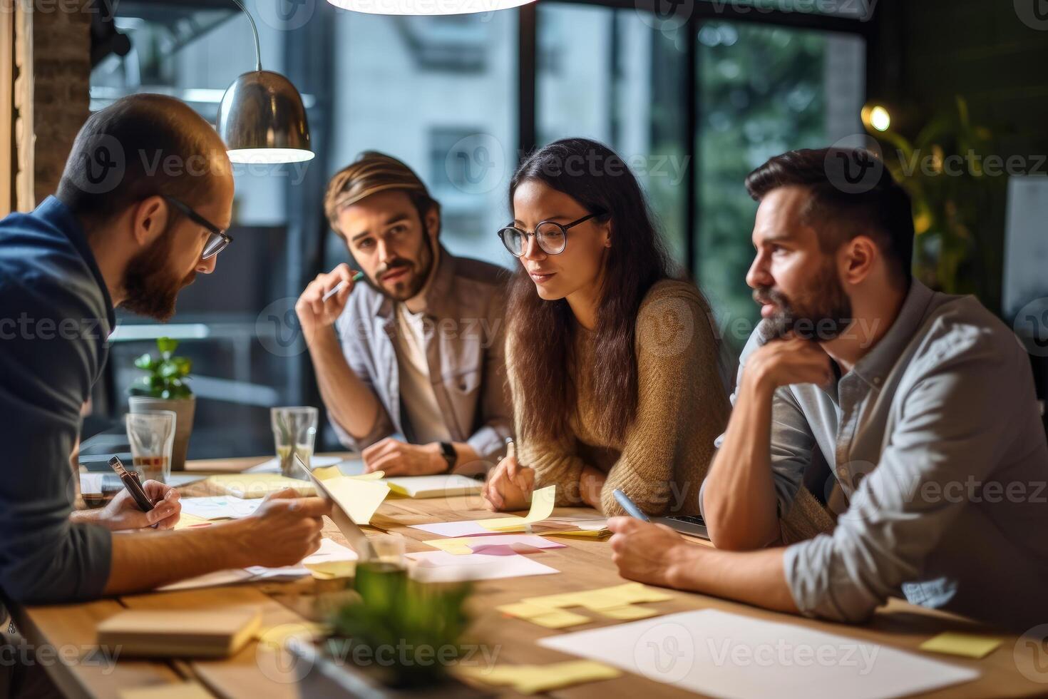 A photo of a team brainstorming and discussing ideas in a creative workspace.