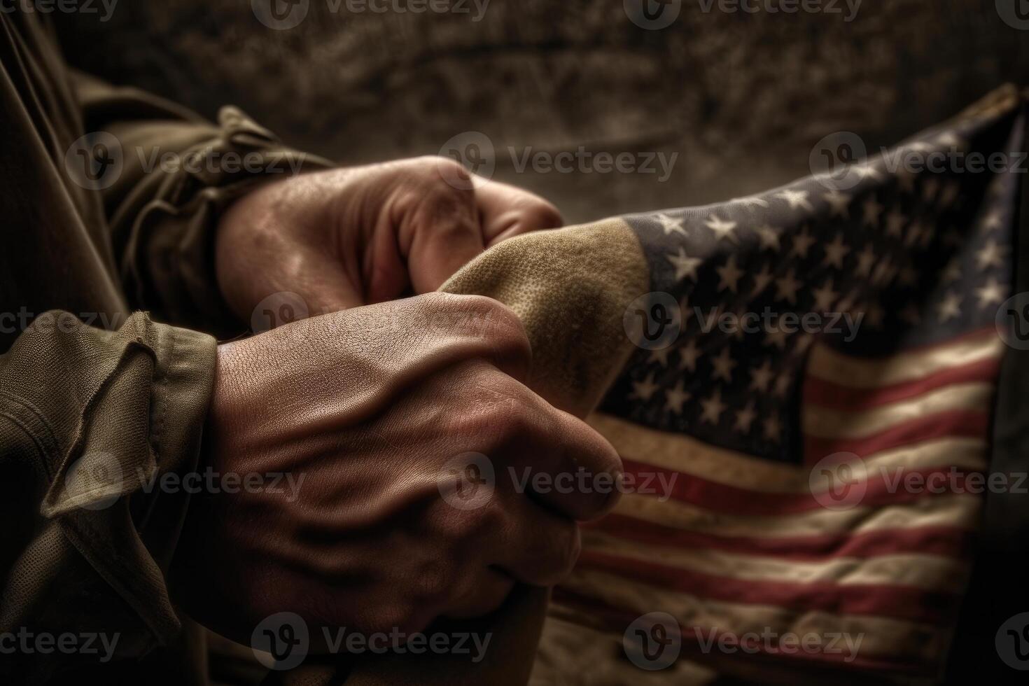 A close - up photo of an American soldier's hand holding a folded American flag, representing honor and sacrifice.