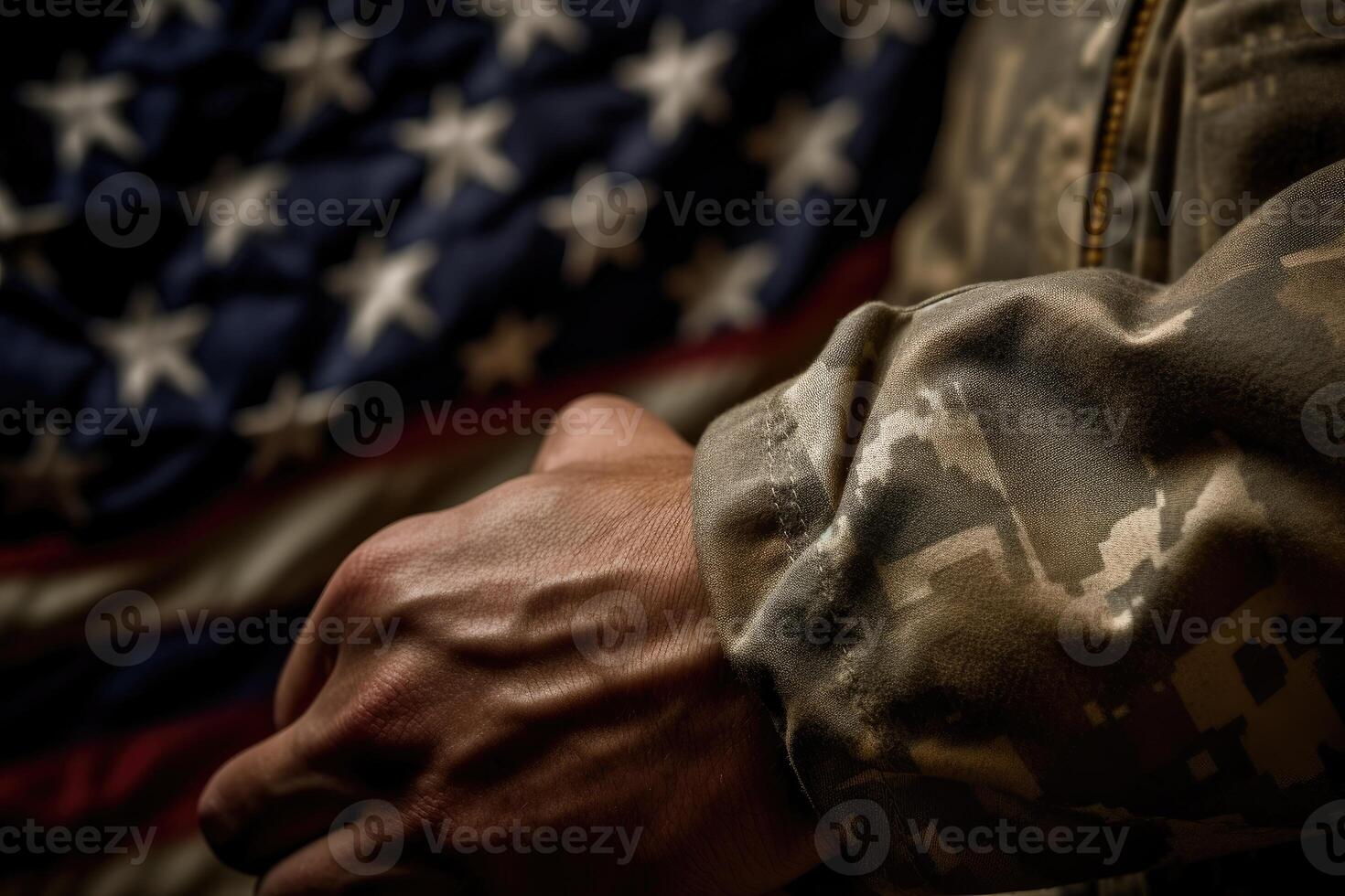 A close - up photo of an American soldier's hand holding a folded American flag, representing honor and sacrifice.