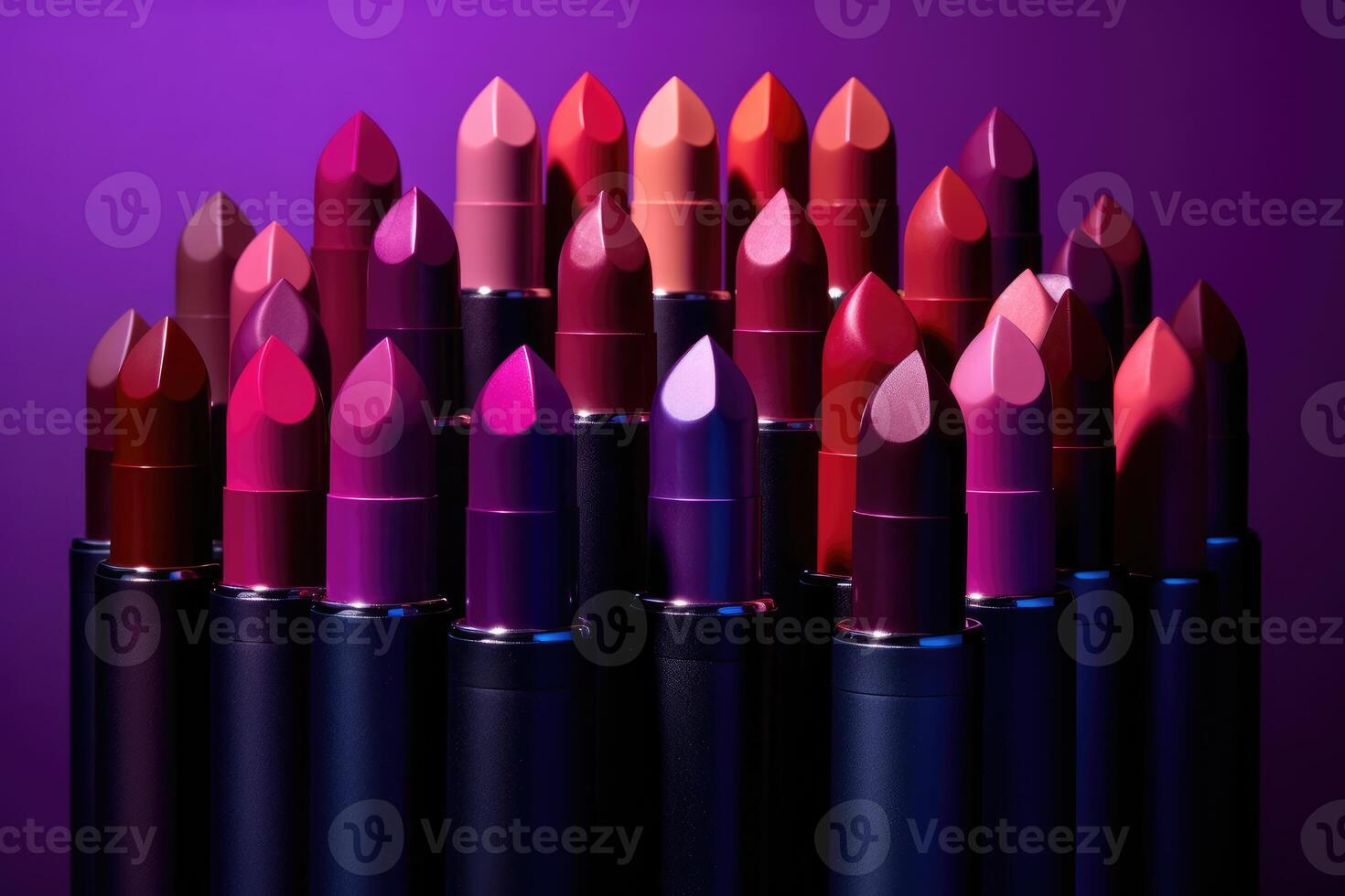 Still life shot of a collection of different lipstick shades arranged in a gradient pattern. photo