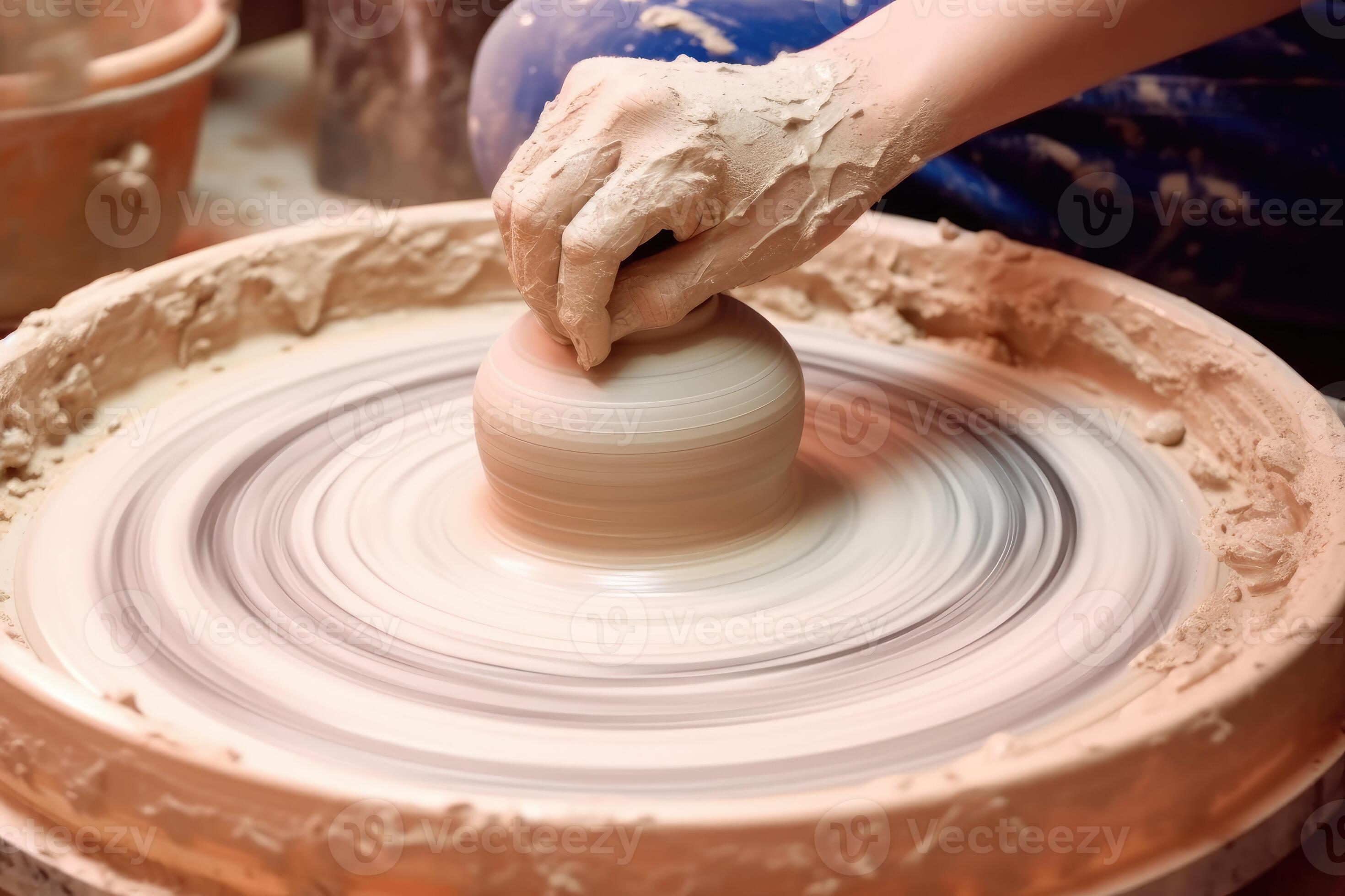 A top view photo of a potter's wheel in motion, showcasing the