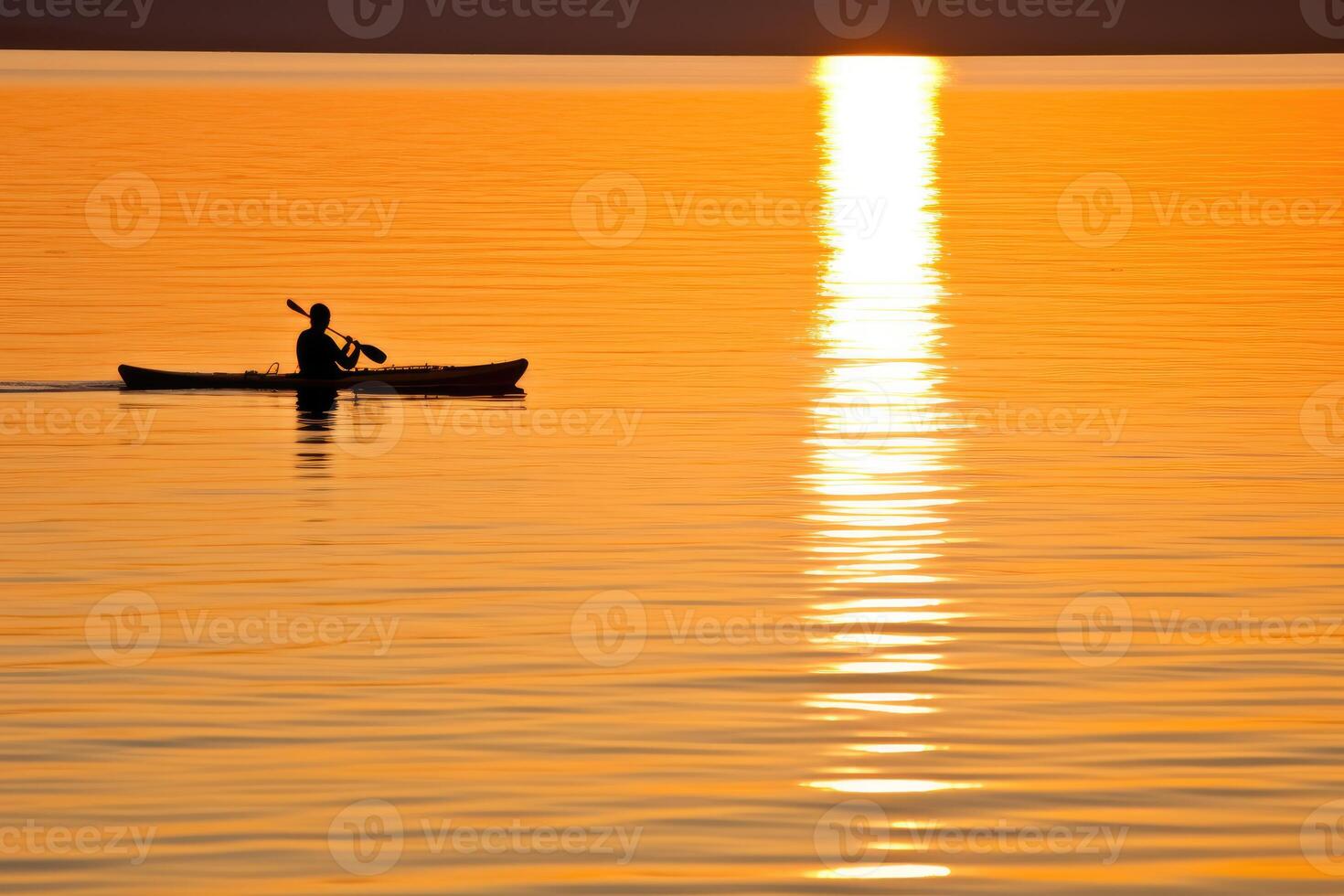 A tranquil and golden sunset kayaking experience. photo