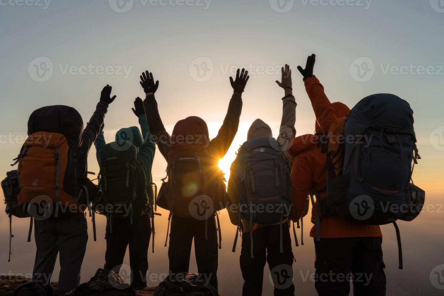A close - up of the hikers' backpacks and hands. photo