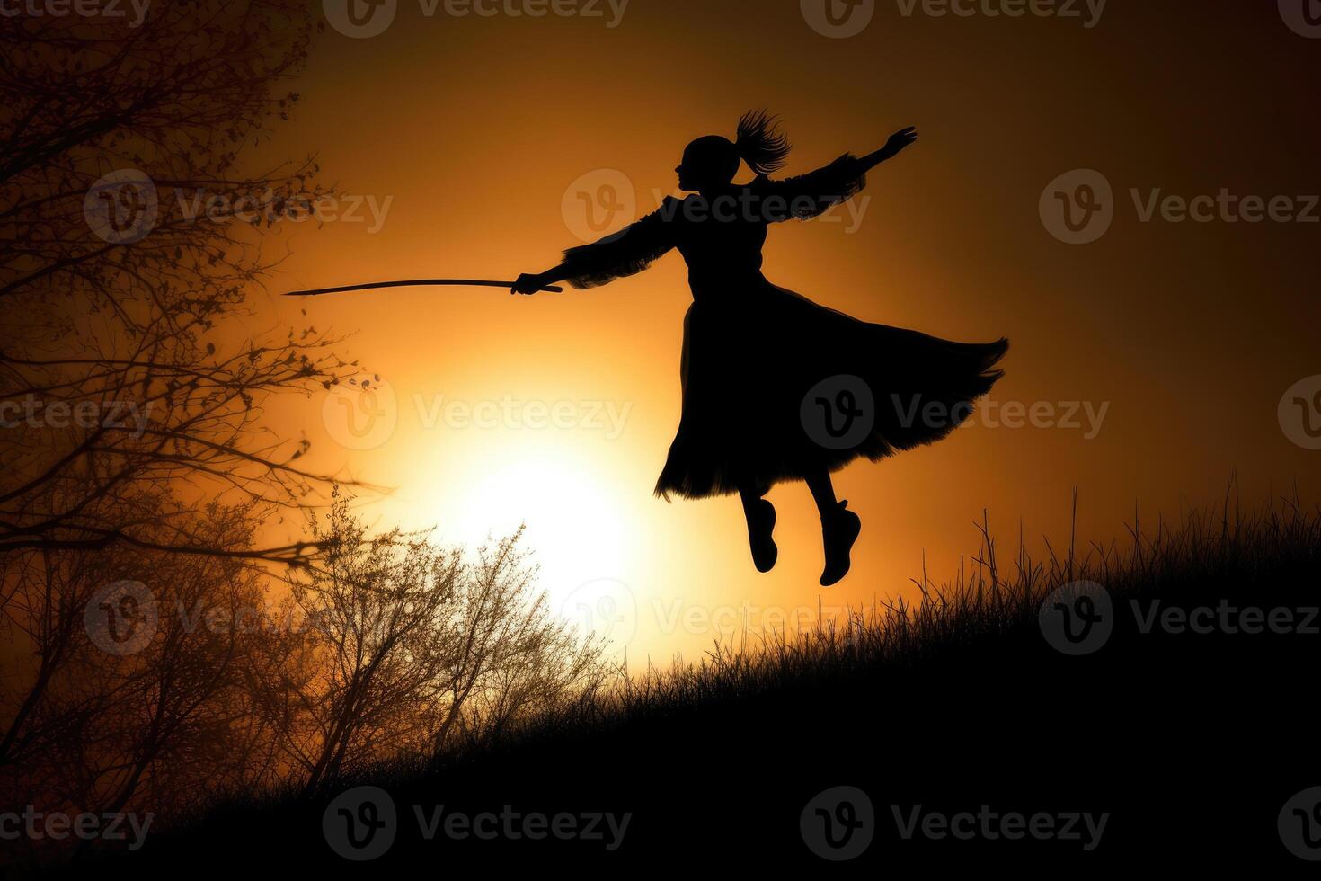 A daring silhouette shot of a witch against the backdrop of a massive, glowing moon. photo