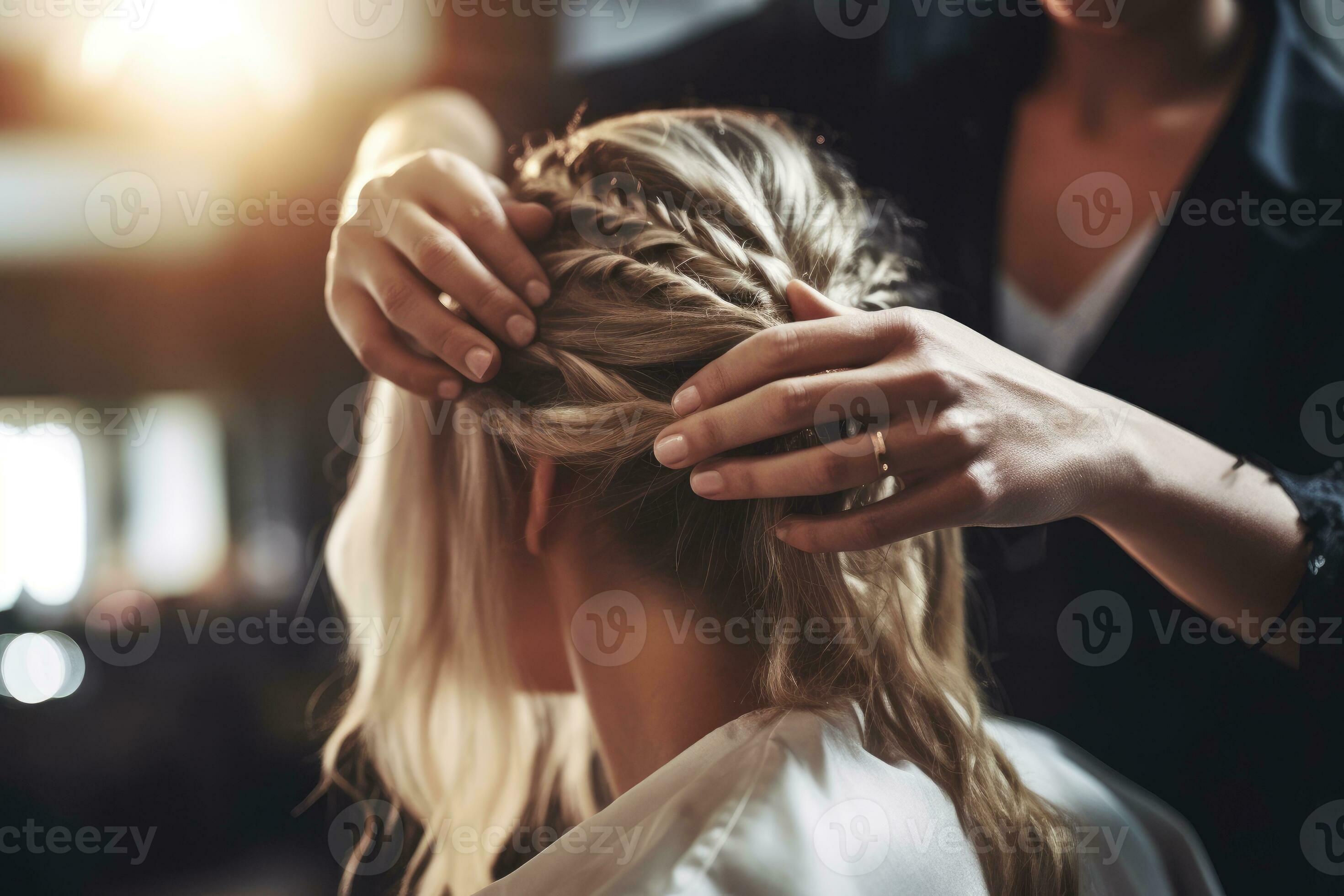 A close - up shot of a fashionable male hair stylist shaping a woman's 