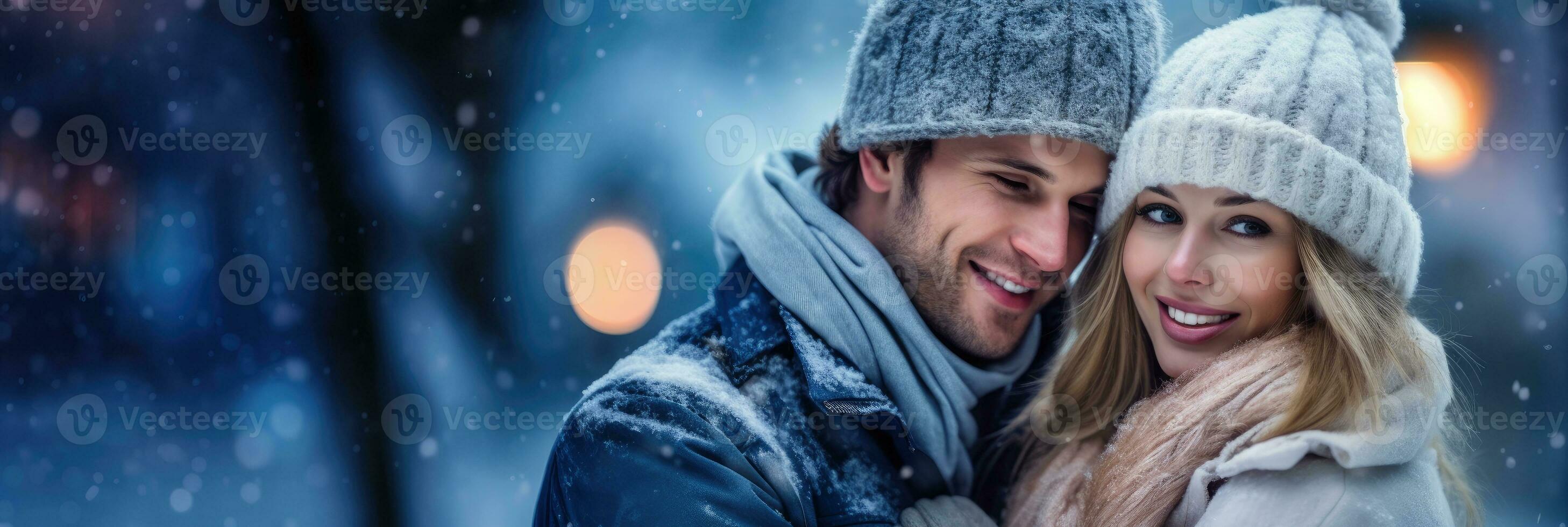 Happy couple posing in the snow on a winter day. Copyspace. photo