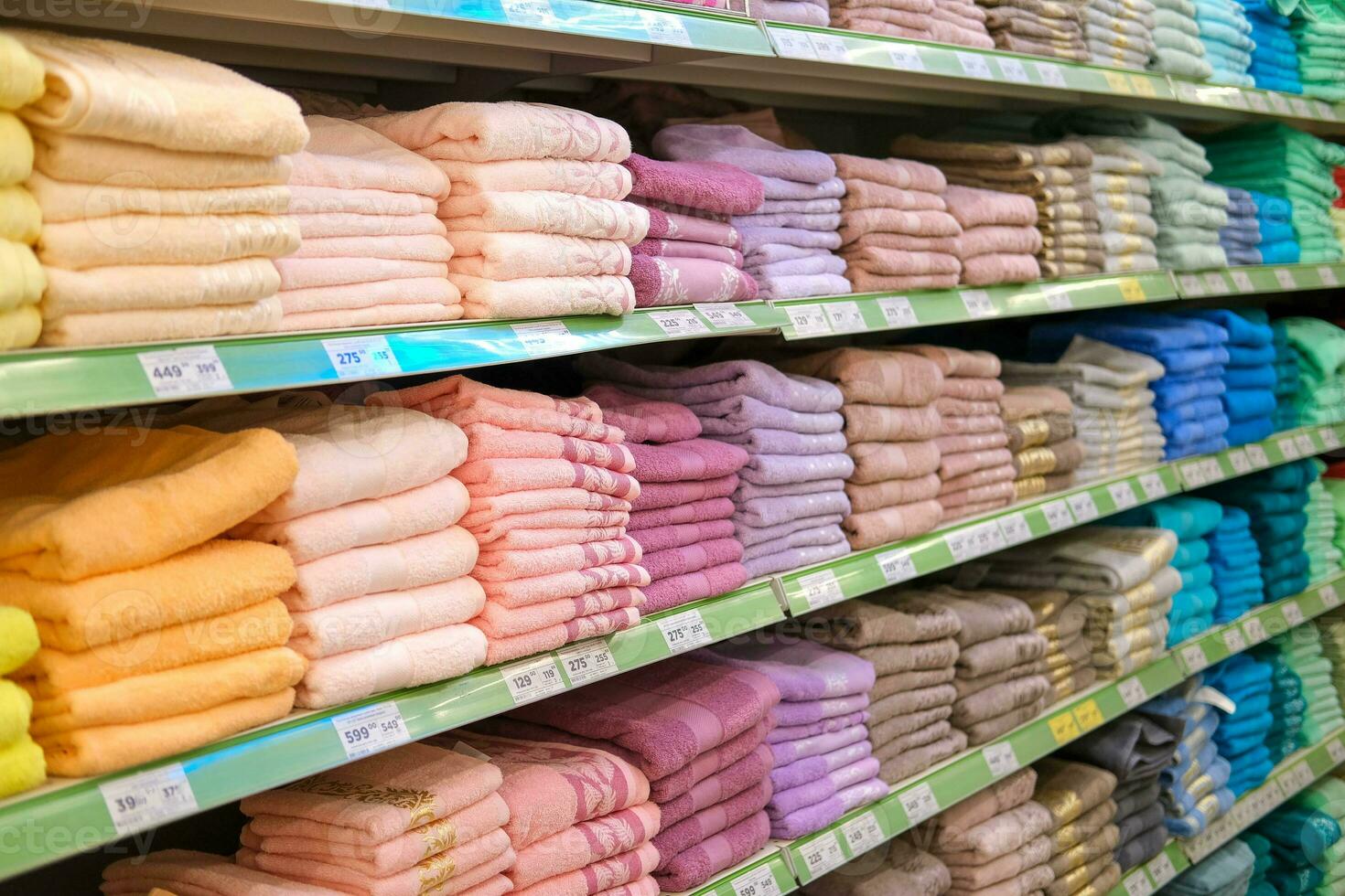 Store shelves with towels. Shop with a wide range of towels. photo