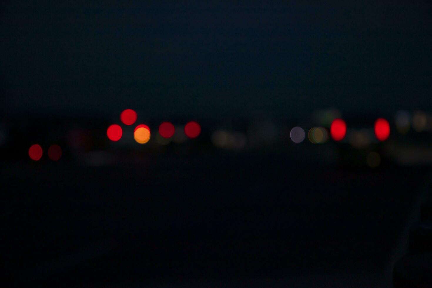 Night city street traffic abstract blurry bokeh lights background photo