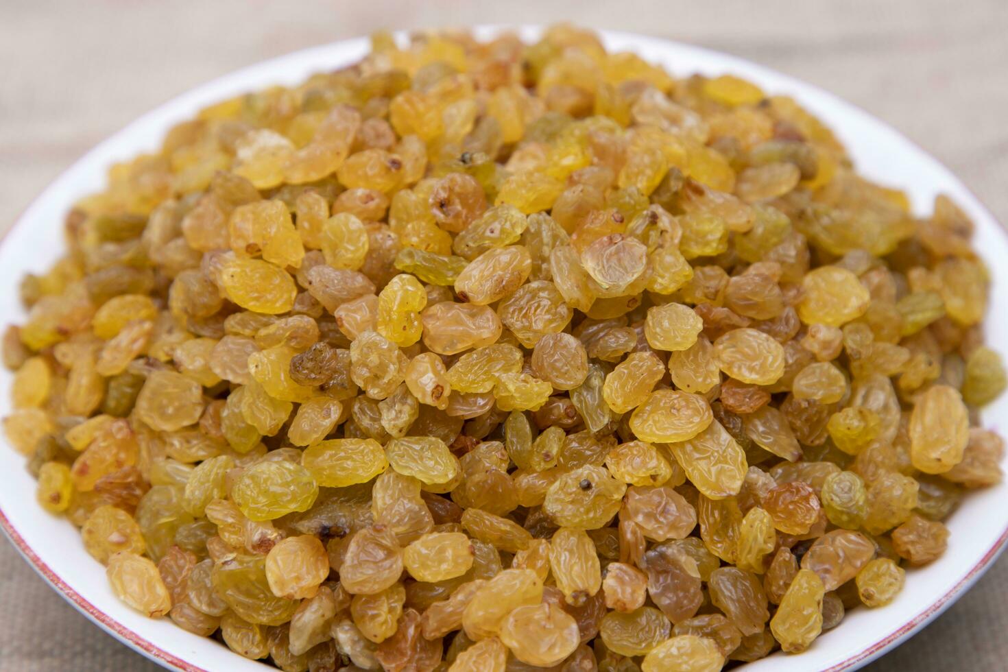 A Bowl of Delicious sweet raisins. Selective Focus photo