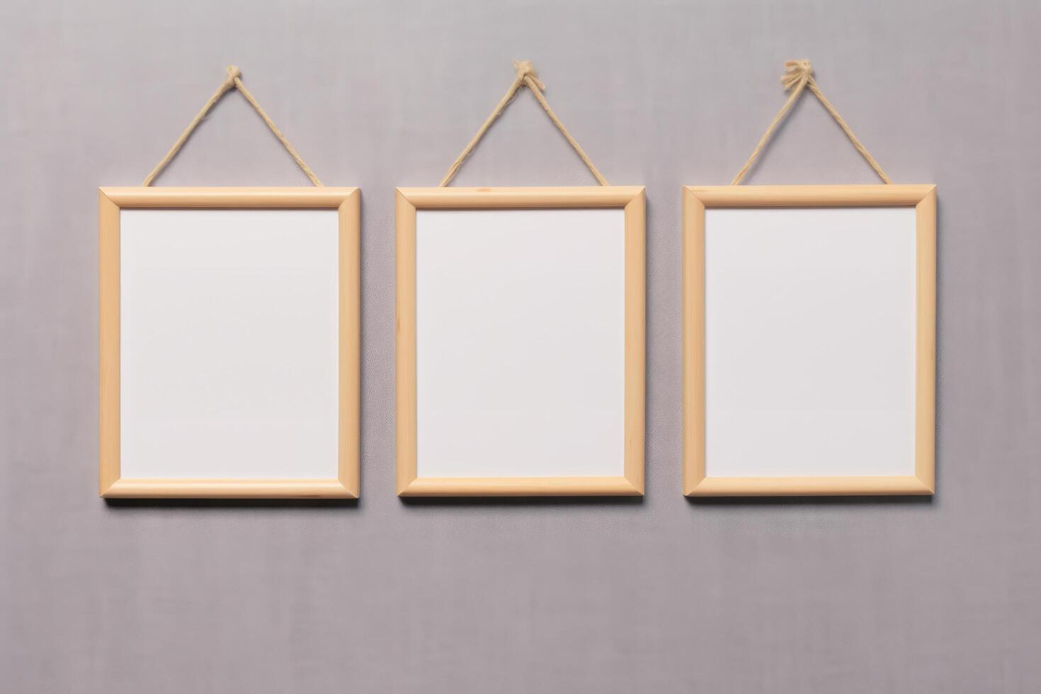 Three Wooden Frames Hanging on a Rope on a Gray Wall AI Generated photo