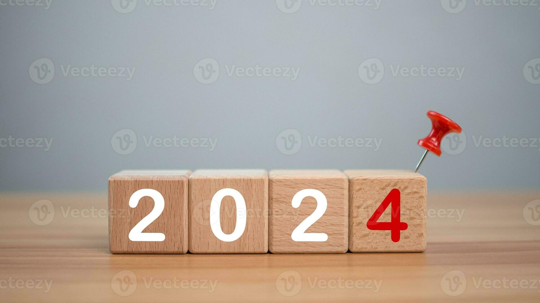 Wooden blocks lined up with the letters 2024. Represents the goal setting for 2024, the concept of a start. financial planning development strategy business goal setting photo