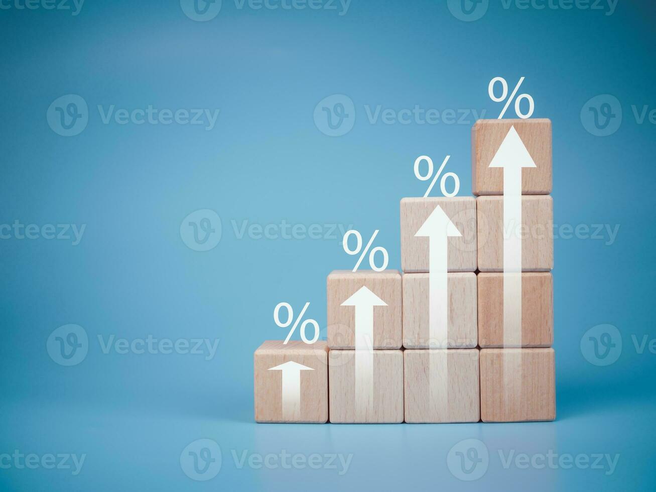 Stacked wooden blocks with percentage icon. For special offers of department store discounts and tax concepts. photo