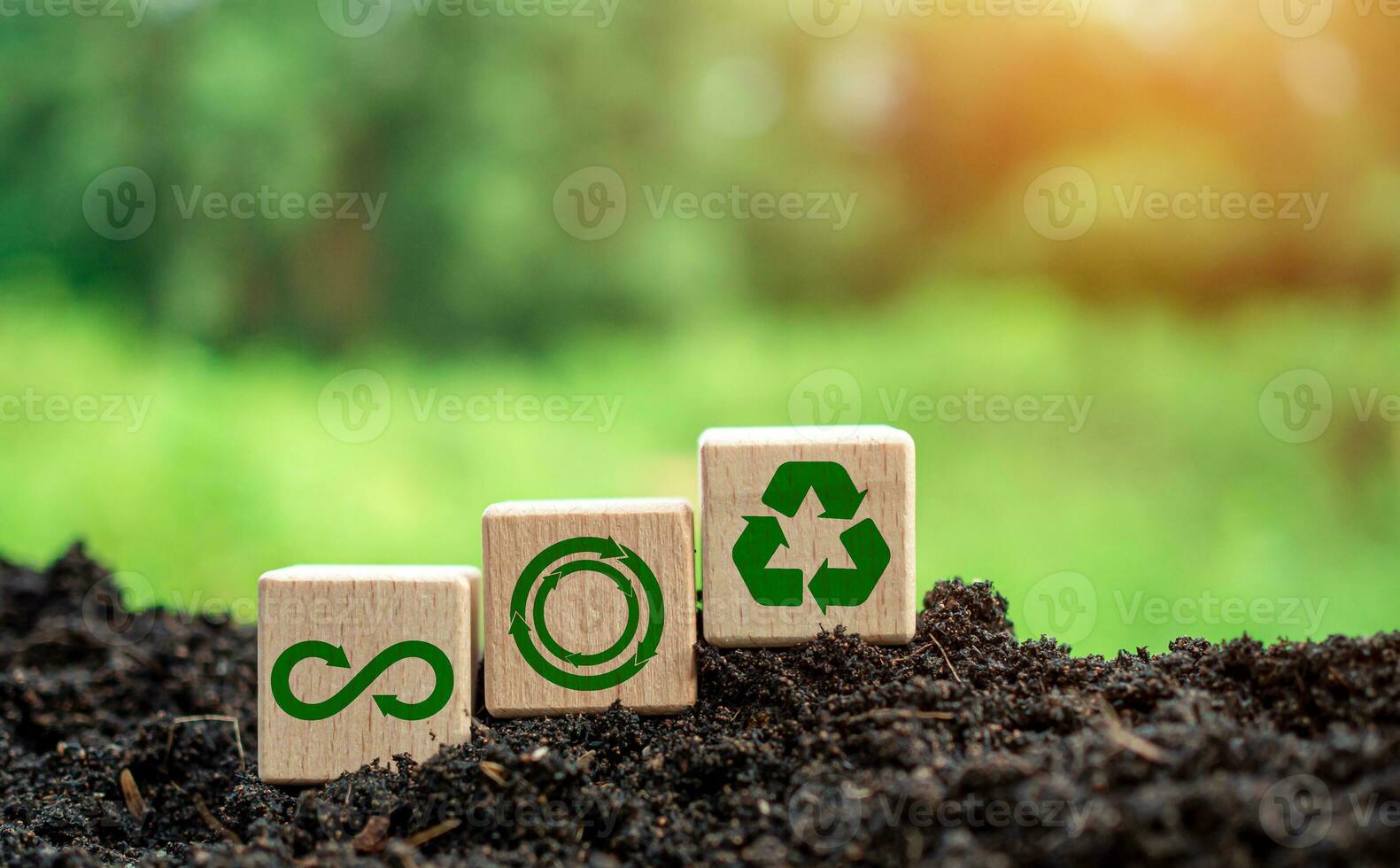 Concepts of waste reduction, pollution, reuse, efficient use of resources. Environmental protection sign by recycling on circular wooden board on nature background. photo