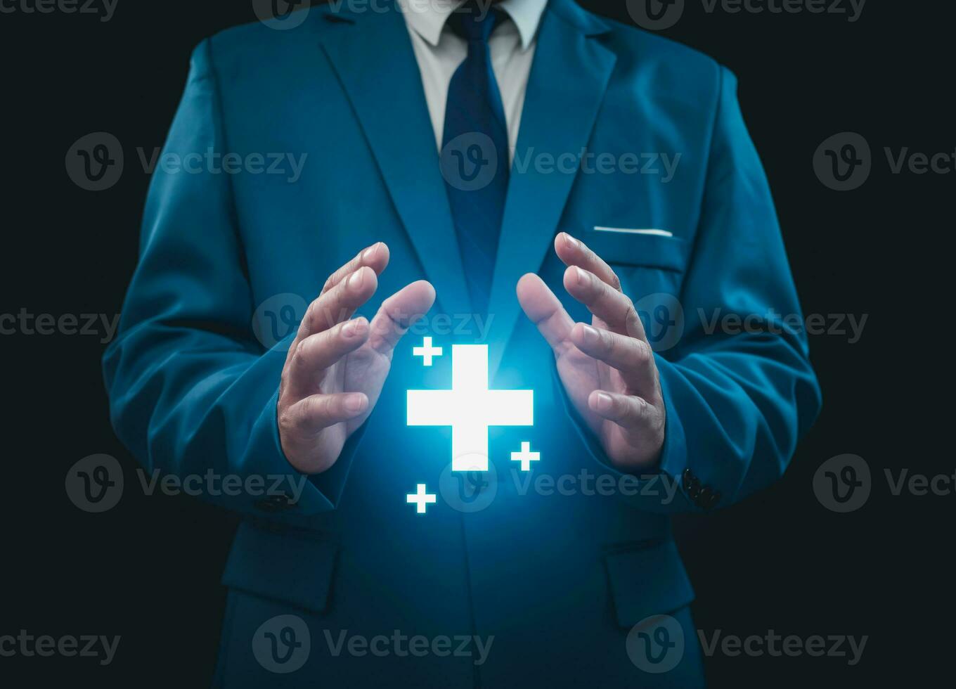 Businessman hold in hand offer positive thing such as profit, benefits, development, CSR represented by plus sign, healthcare insurance.The hand shows the plus sign. photo