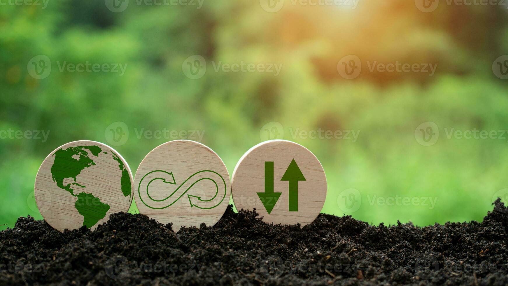 Concepts of waste reduction, pollution, reuse, efficient use of resources. Environmental protection sign by recycling on circular wooden board on nature background. photo