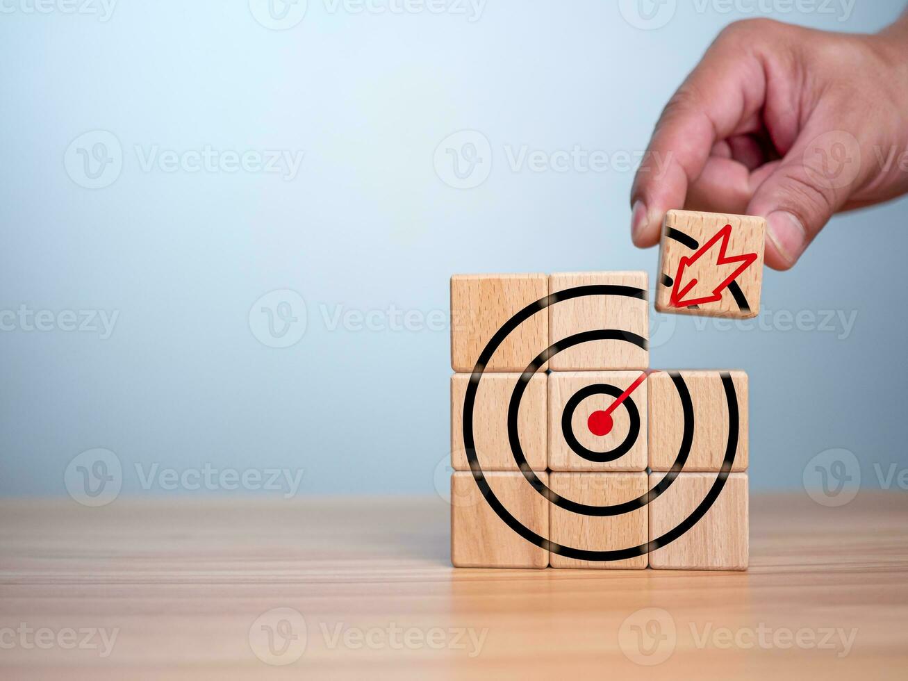 Businessman hands are completing wooden blocks with target sign. Startup concept. Business concept. Management concept. Business planning concept. photo