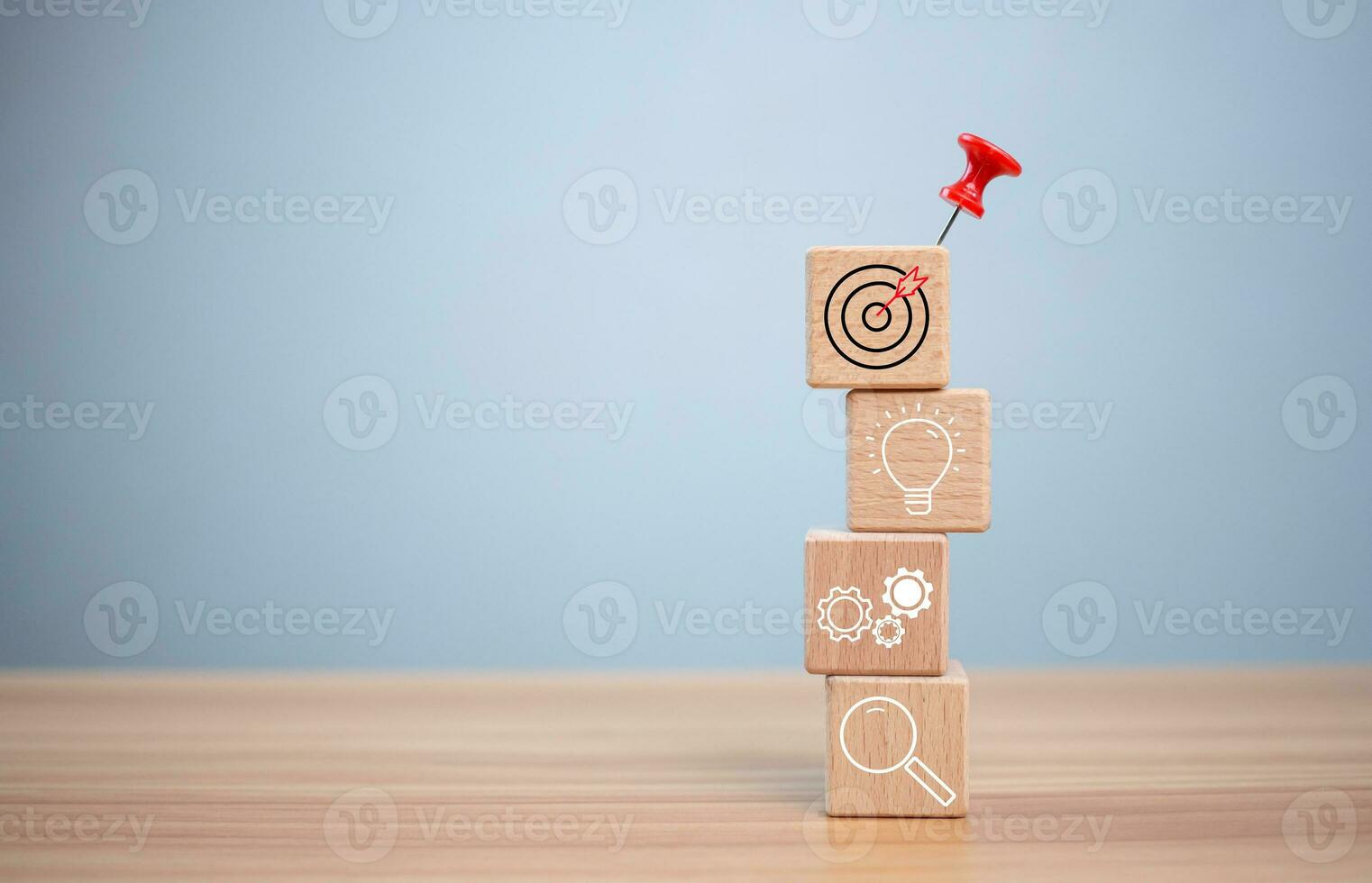 Red push pin to target and success on wooden block. Startup concept. Business concept. Management concept. Business planning concept. photo