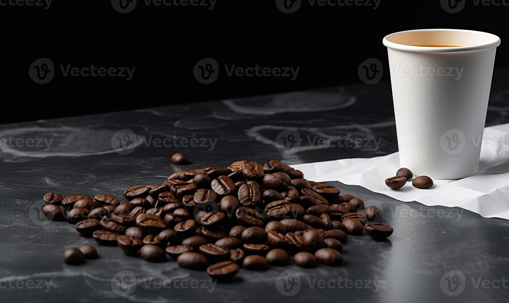 Coffee with croissant and coffee beans on black background photo