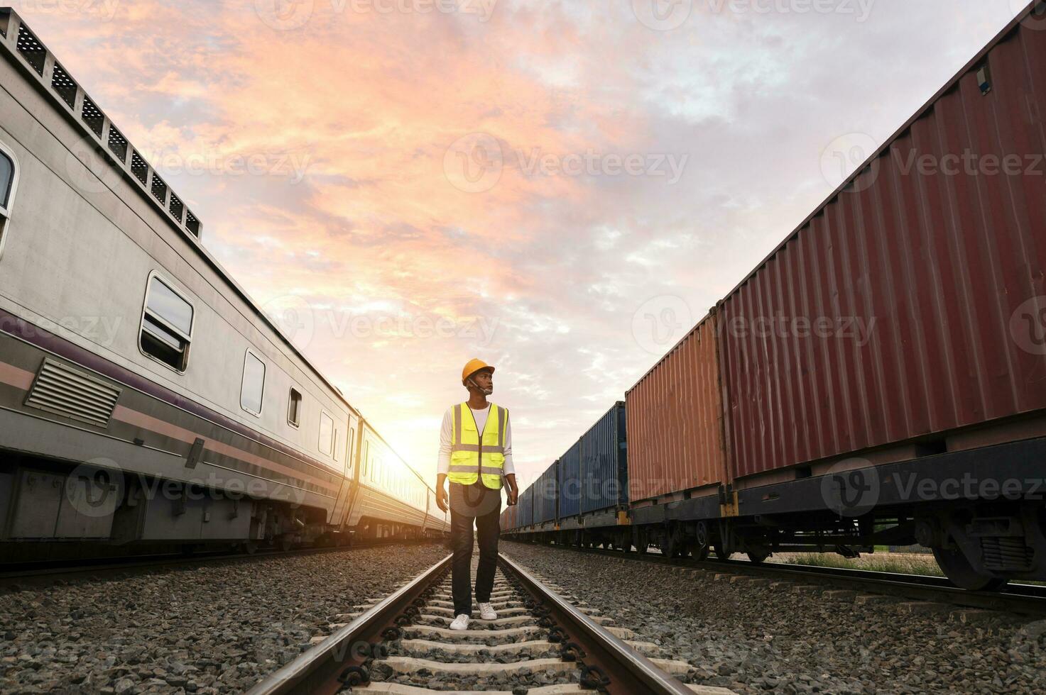 Engineer inspects container train of transport company Distribution and transportation of goods by rail A container train passing through an industrial area photo