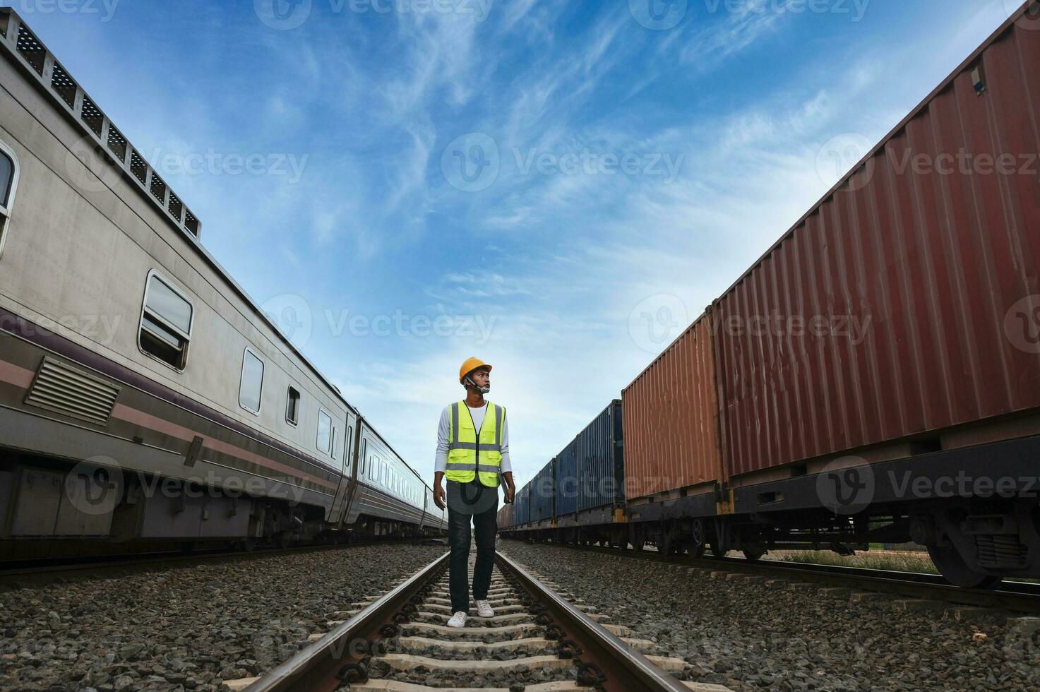 Engineer inspects container train of transport company Distribution and transportation of goods by rail A container train passing through an industrial area photo