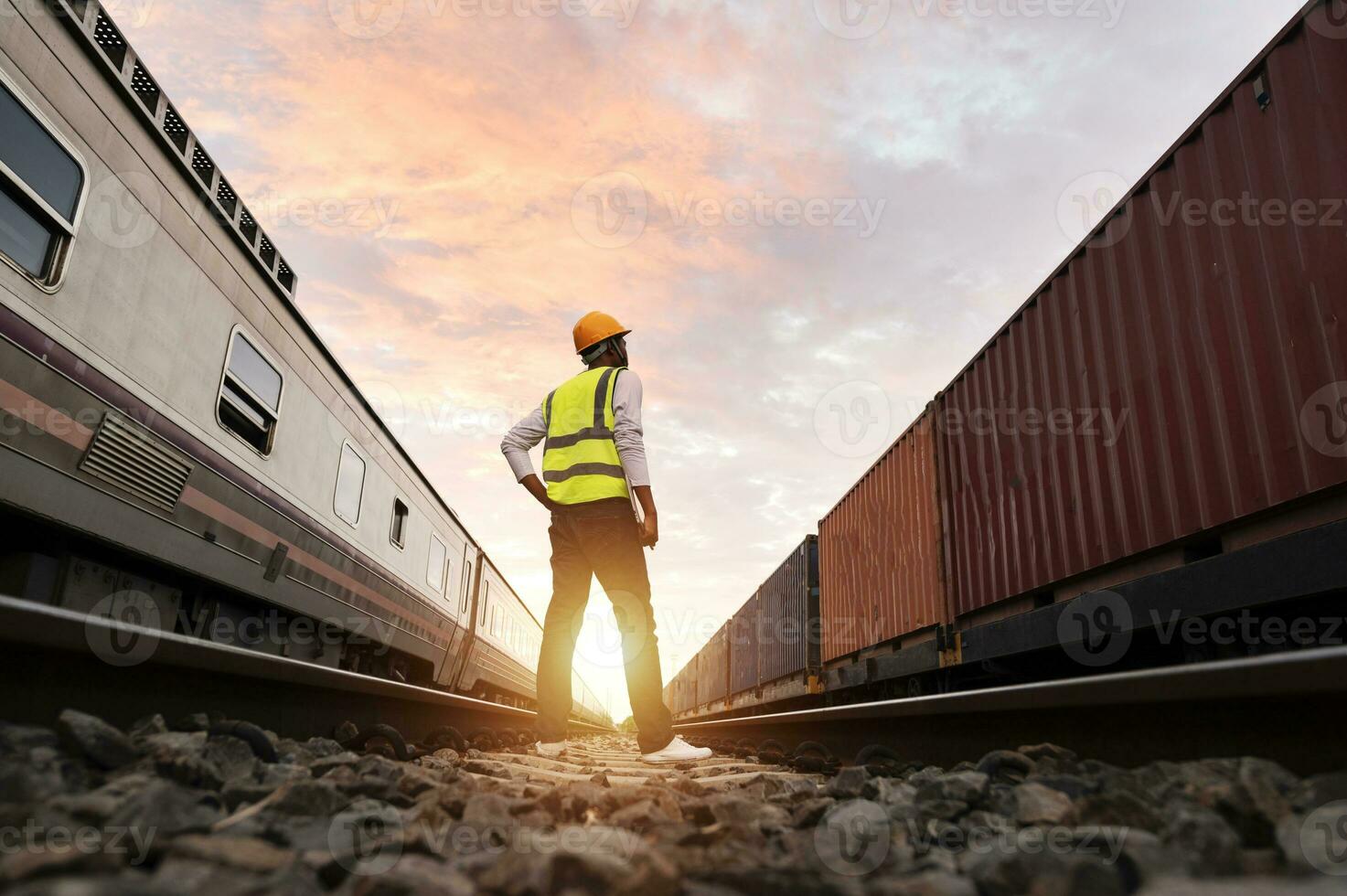 Engineer inspects container train of transport company Distribution and transportation of goods by rail A container train passing through an industrial area photo