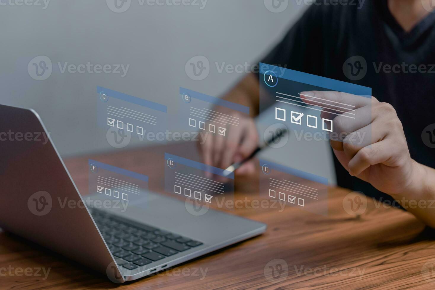 man chooses questionnaire with checkbox, survey form online, answer questions in the exam of test business checklist and filling survey form online using technology for education, learning. photo