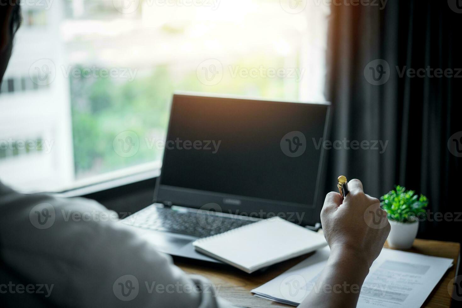 man holding pen with writing on paper report or signature law, contract at desk. legal projects, formal agreements and partnerships. photo
