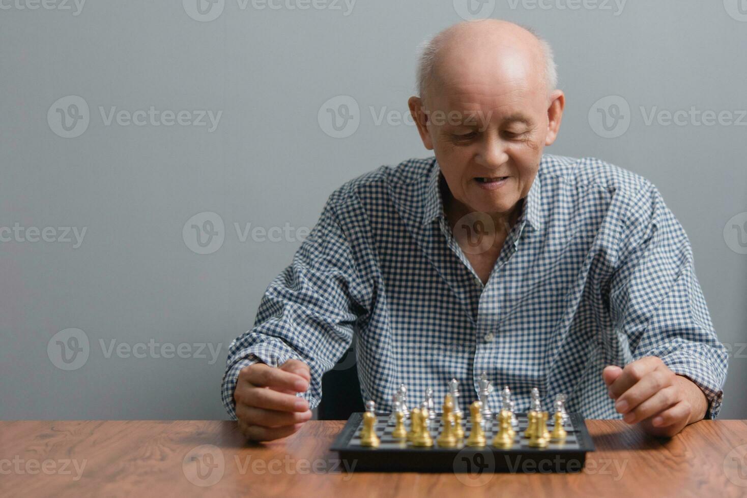 Asian elderly man talking mobile phone at home sofa. Technology communication and social networks concept. photo