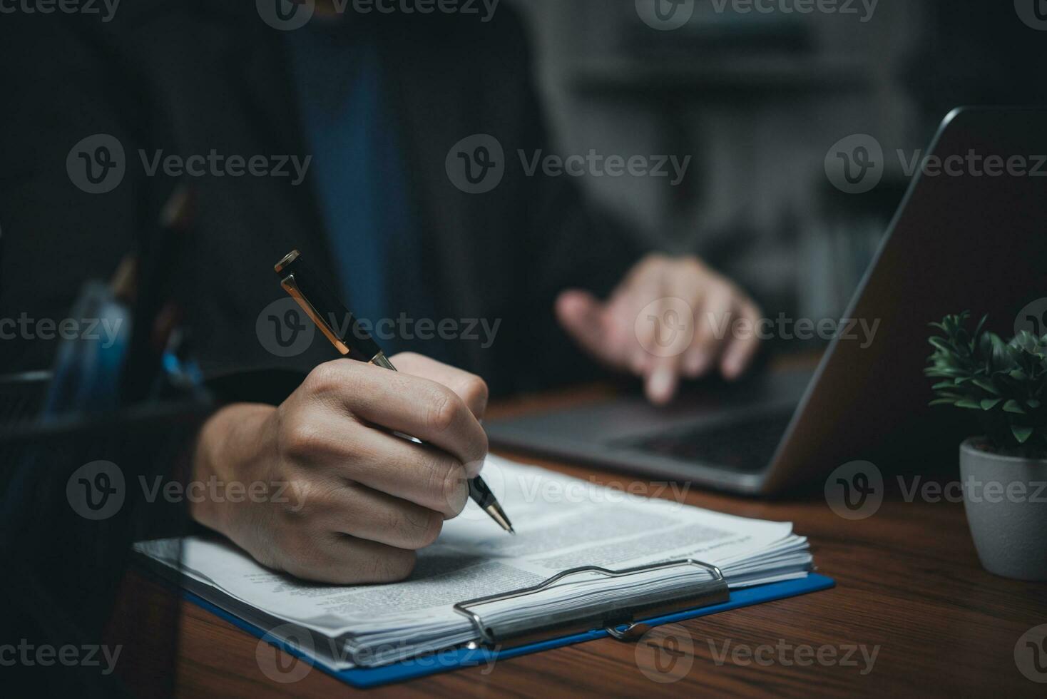 Business person Writing contract law and paper work for business and finance, write document, complete job application forms, contract real estate and insurance concept. photo