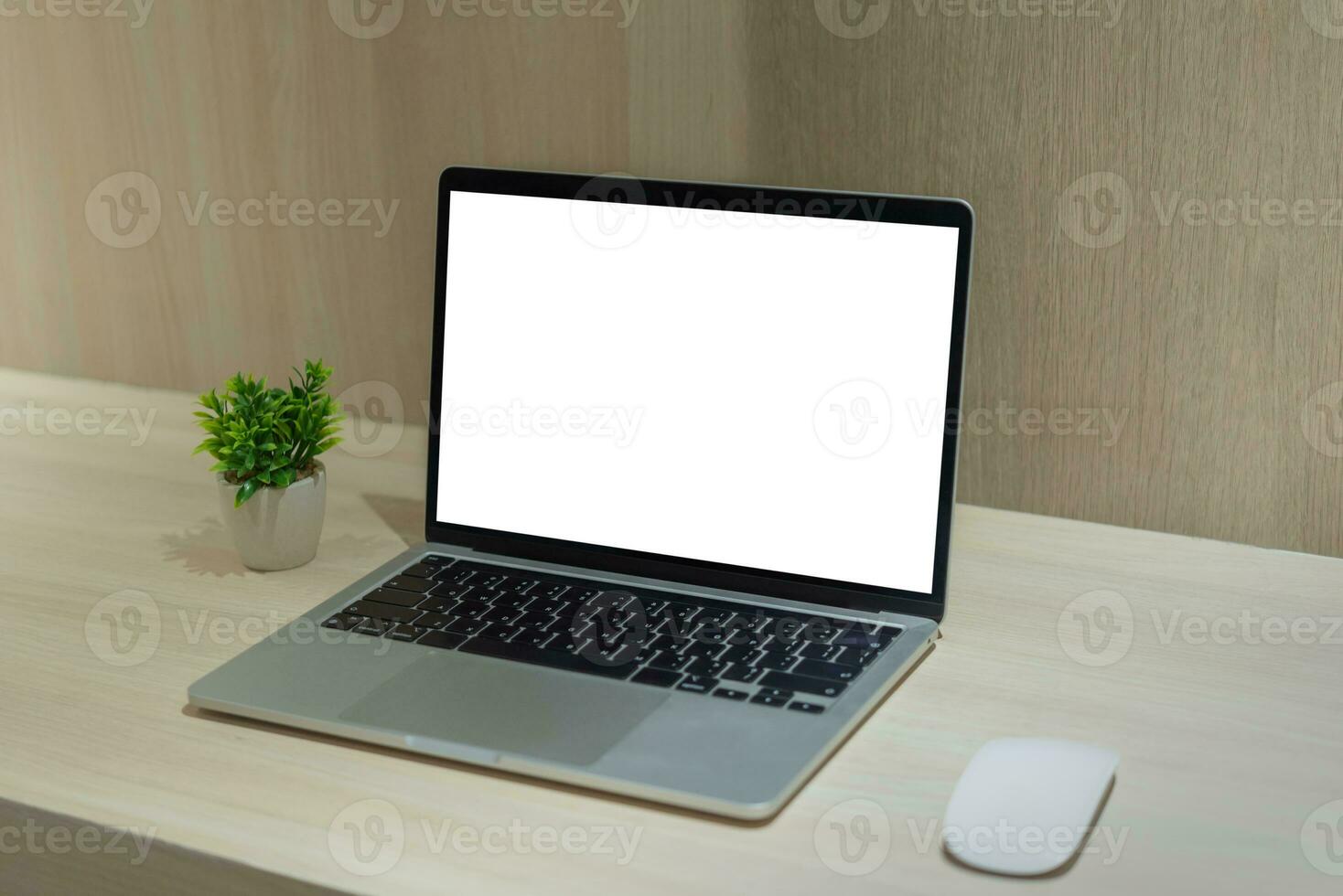 Mock up laptop computer blank white screen on desk. photo