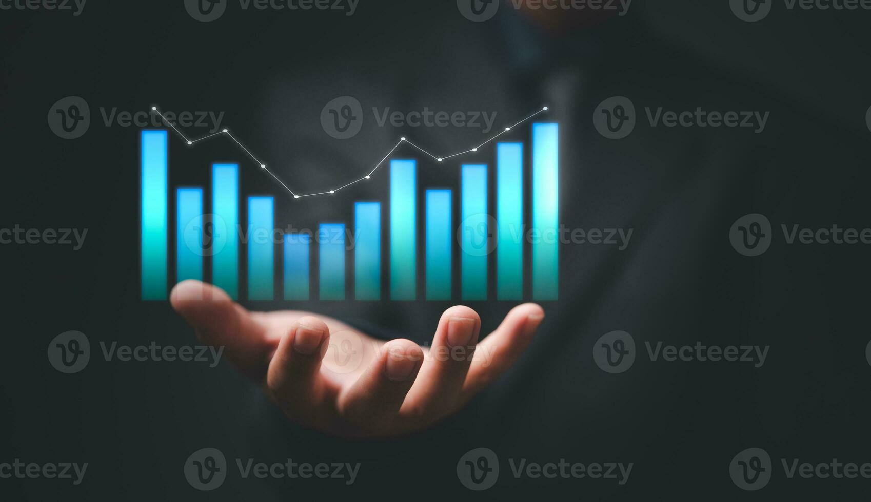 Hand showing graph and chart virtual hologram of statistics with arrow up on virtual interface. Digital marketing. Planning and strategy development Stock market. Business growth concept. photo